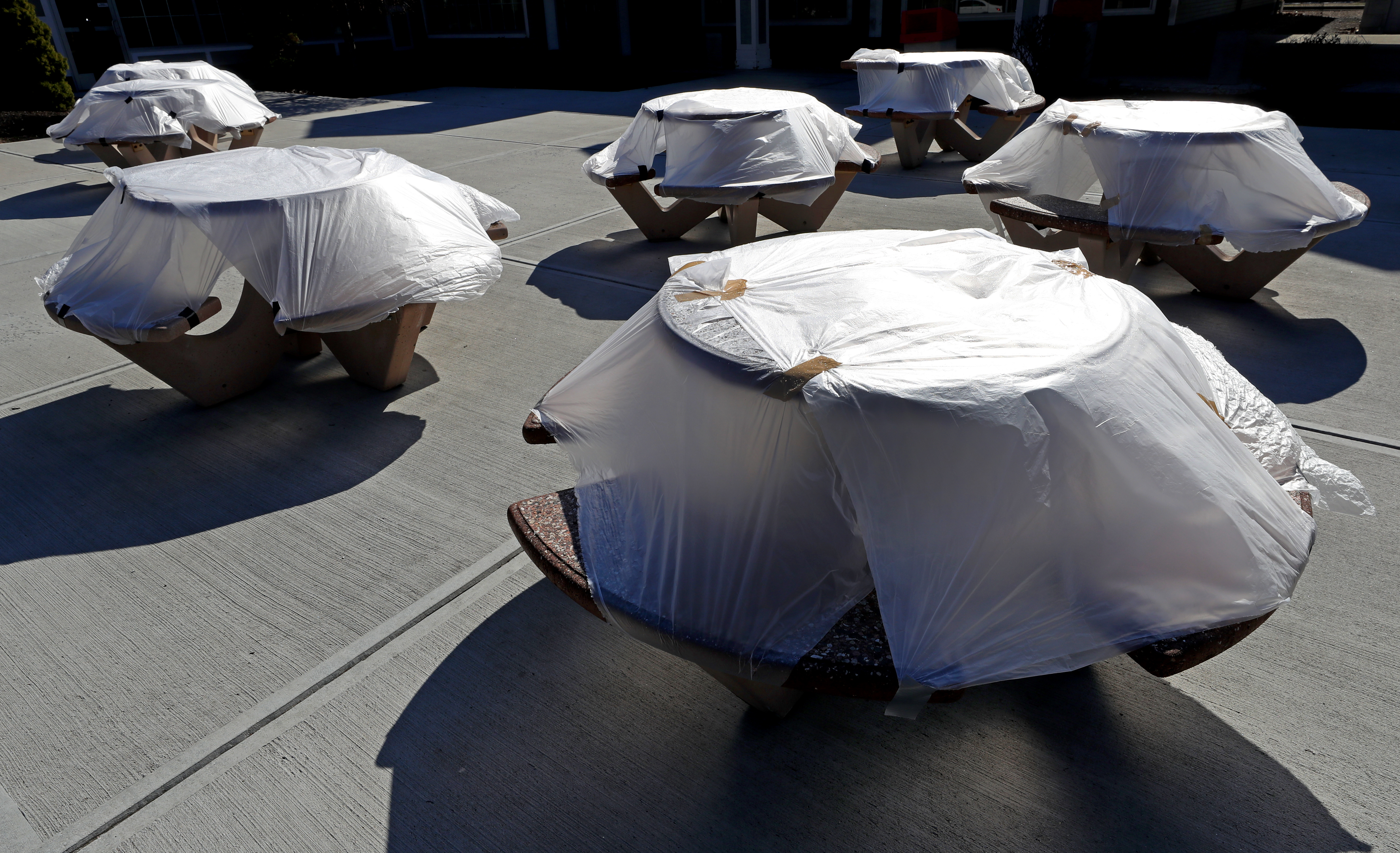 FRAMINGHAM, MA - 3/26/2020: Outdoor tables covered in plastic wrap at the Framingham Service Plaza on the Massachusetts Turnpike because of COVID-19 coronavirus pandemic.  (David L Ryan/Globe Staff ) 