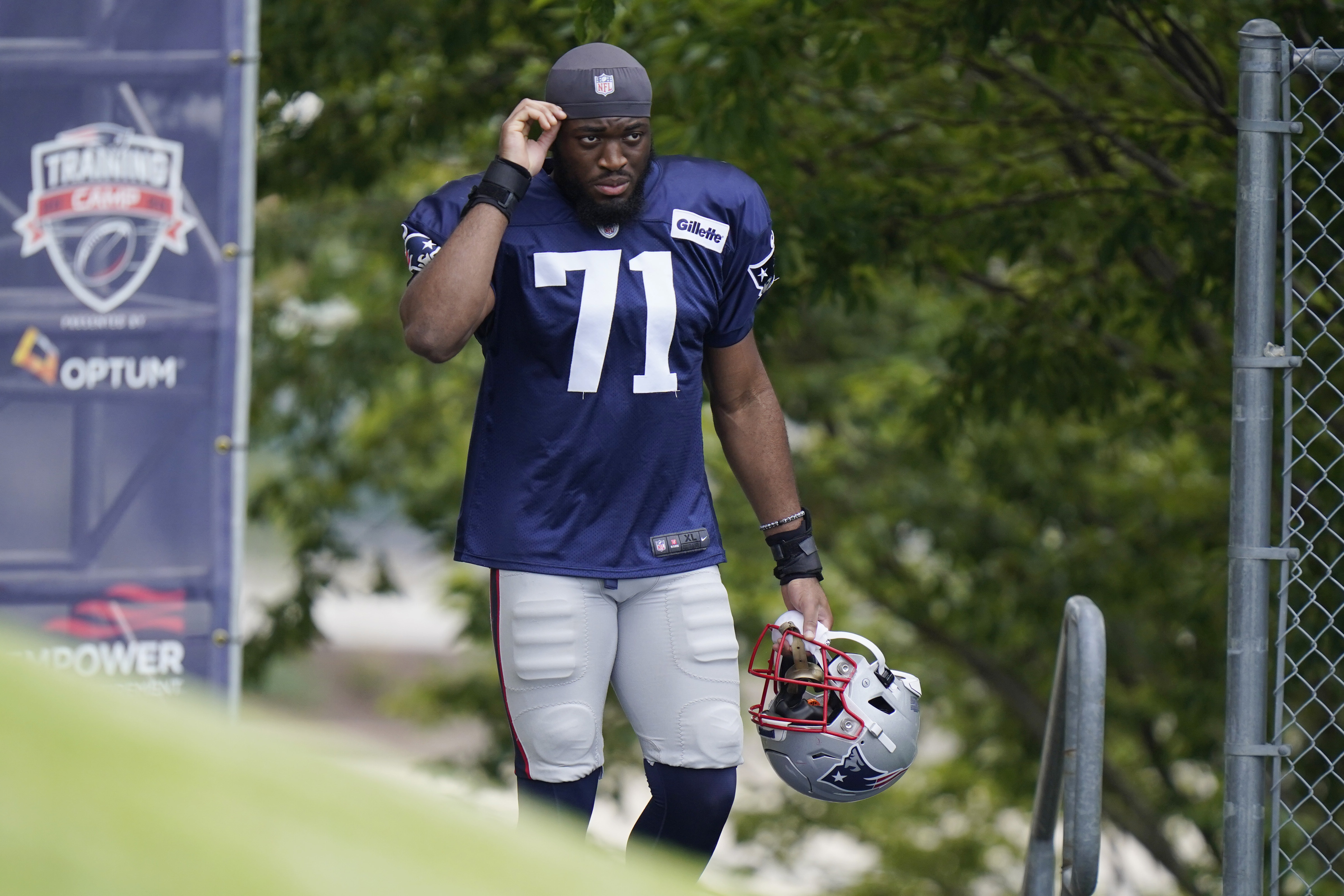Josh Uche, seen here before an August workout, was back at practice Wednesday.