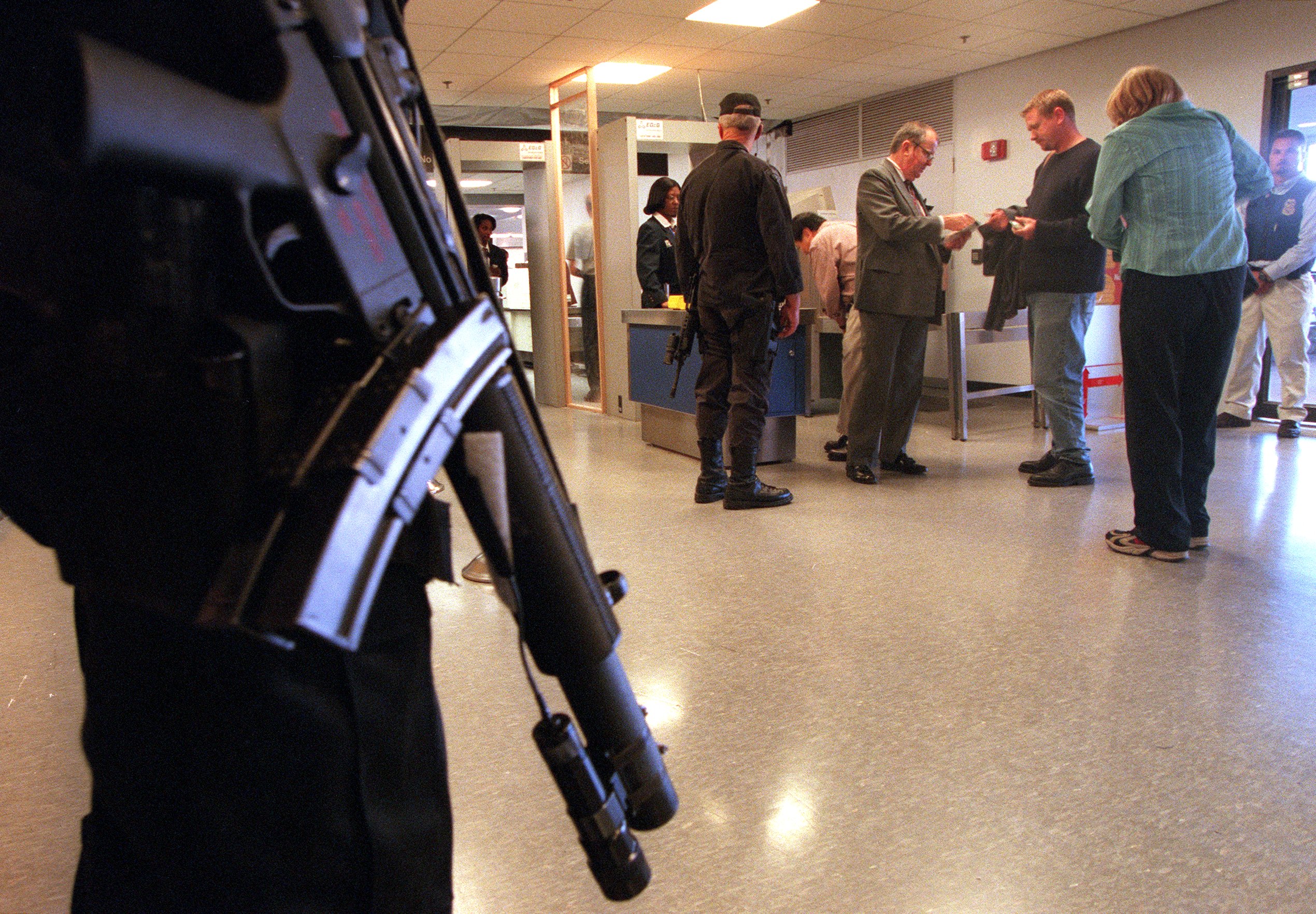 A State Police S.T.O.P. (Special Tactical Operations) team member stood guard at the security check point in Terminal C at Logan on Sept. 15, 2001.