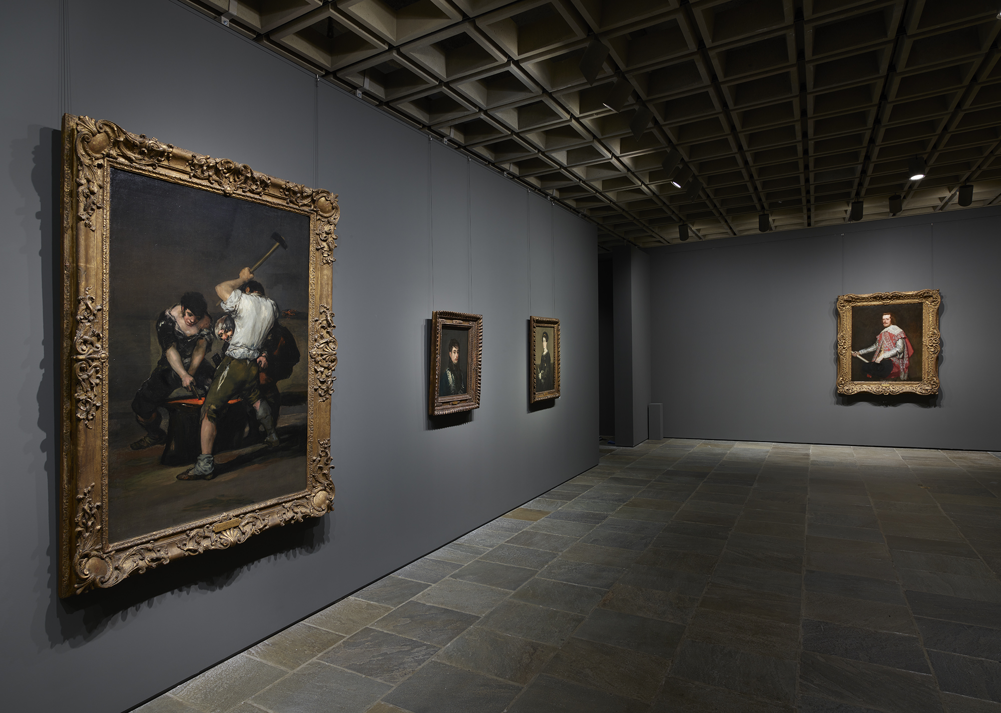 In the Spanish gallery, works include Goya's "The Forge" (on the left) and Velázquez’s portrait of King Phillip IV of Spain (on the back wall).