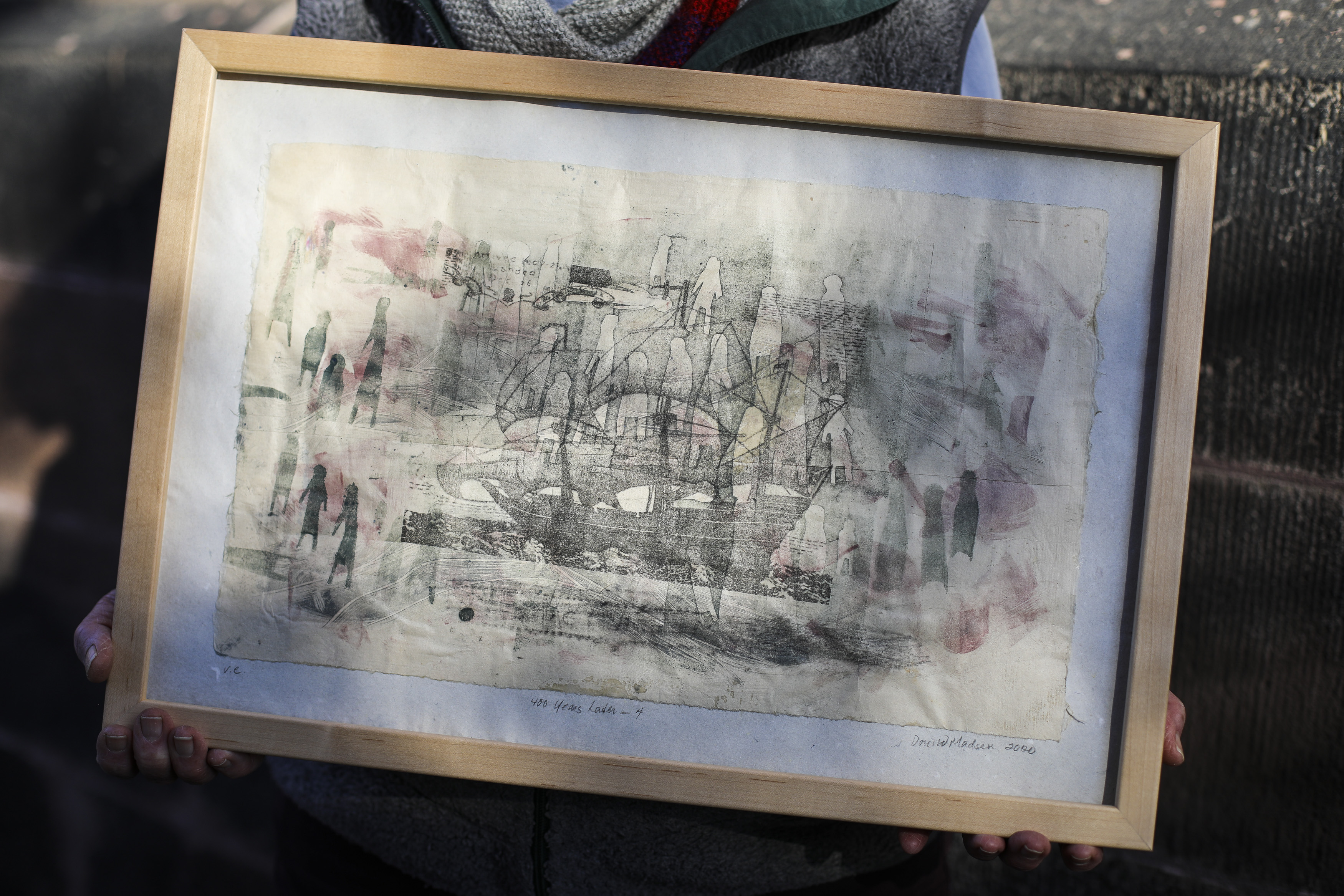Doris Madsen holds her print "400 Years Later, no. 4," which she previously described as containing Indigenous "ghosts."