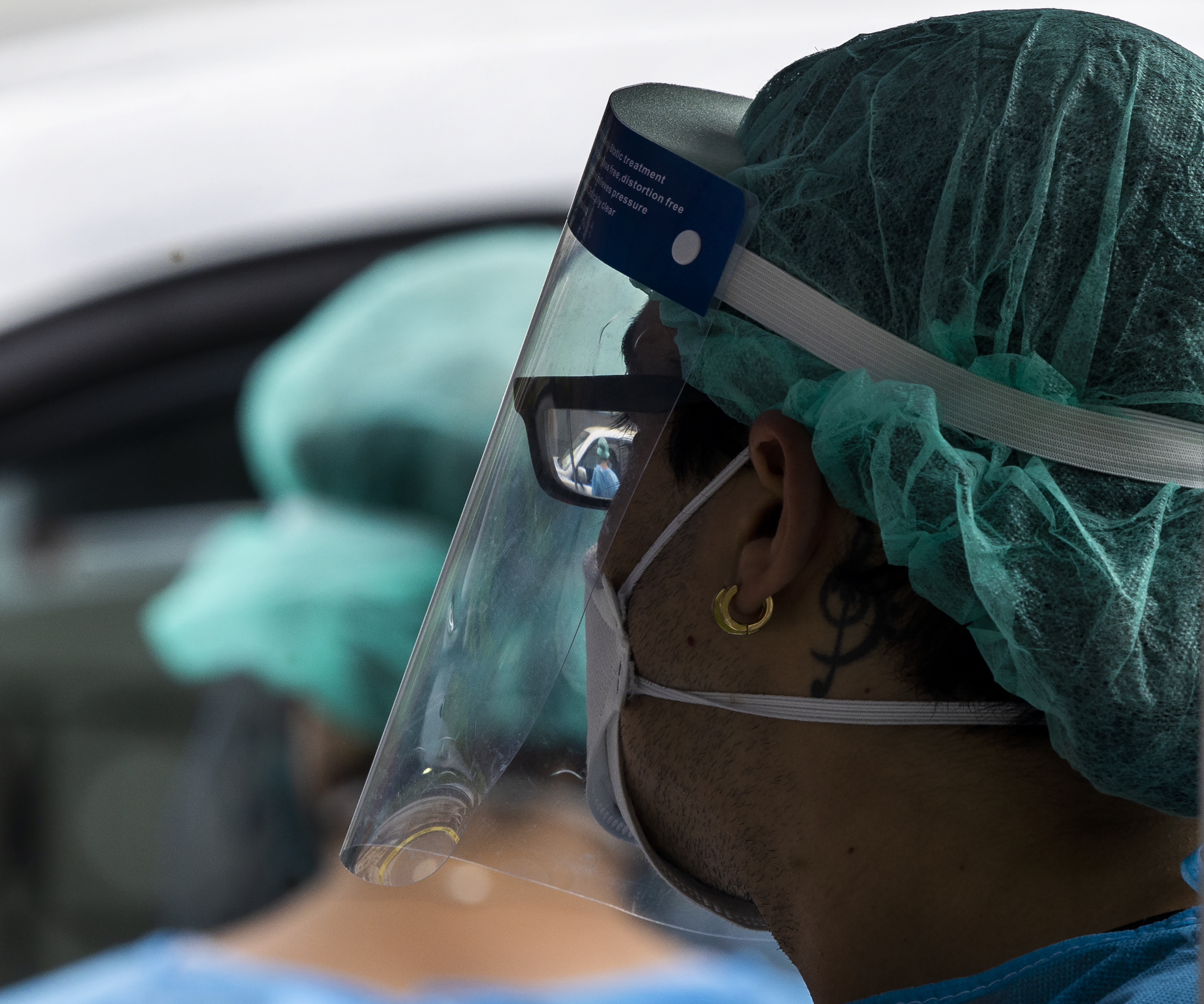 A worker at a coronavirus drive-in testing site in Boston's South End.