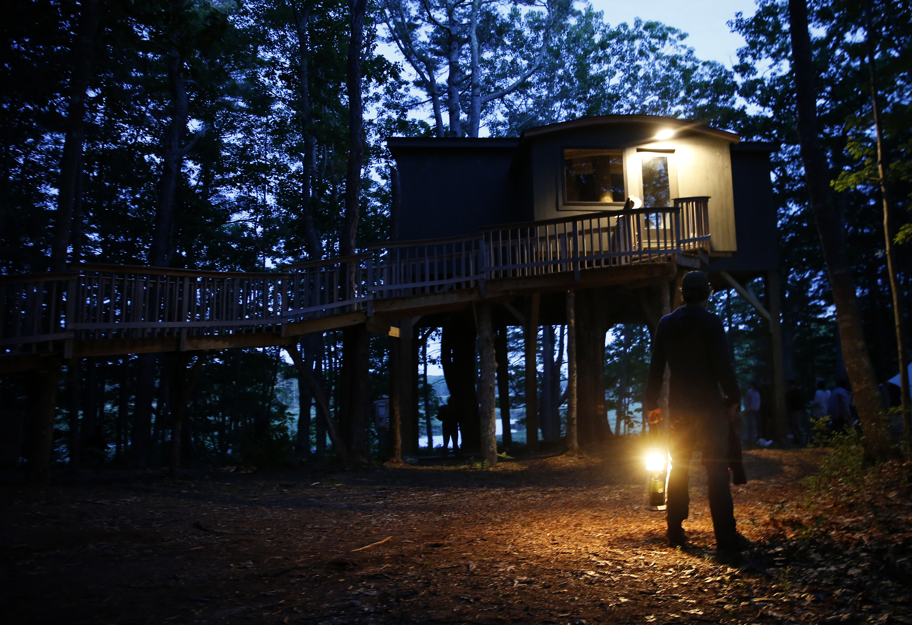 Philip Francis, who cofounded Seguinland Institute, held a lantern as he stood in front of the gathering space, nestled in a treehouse In Georgetown, Maine.