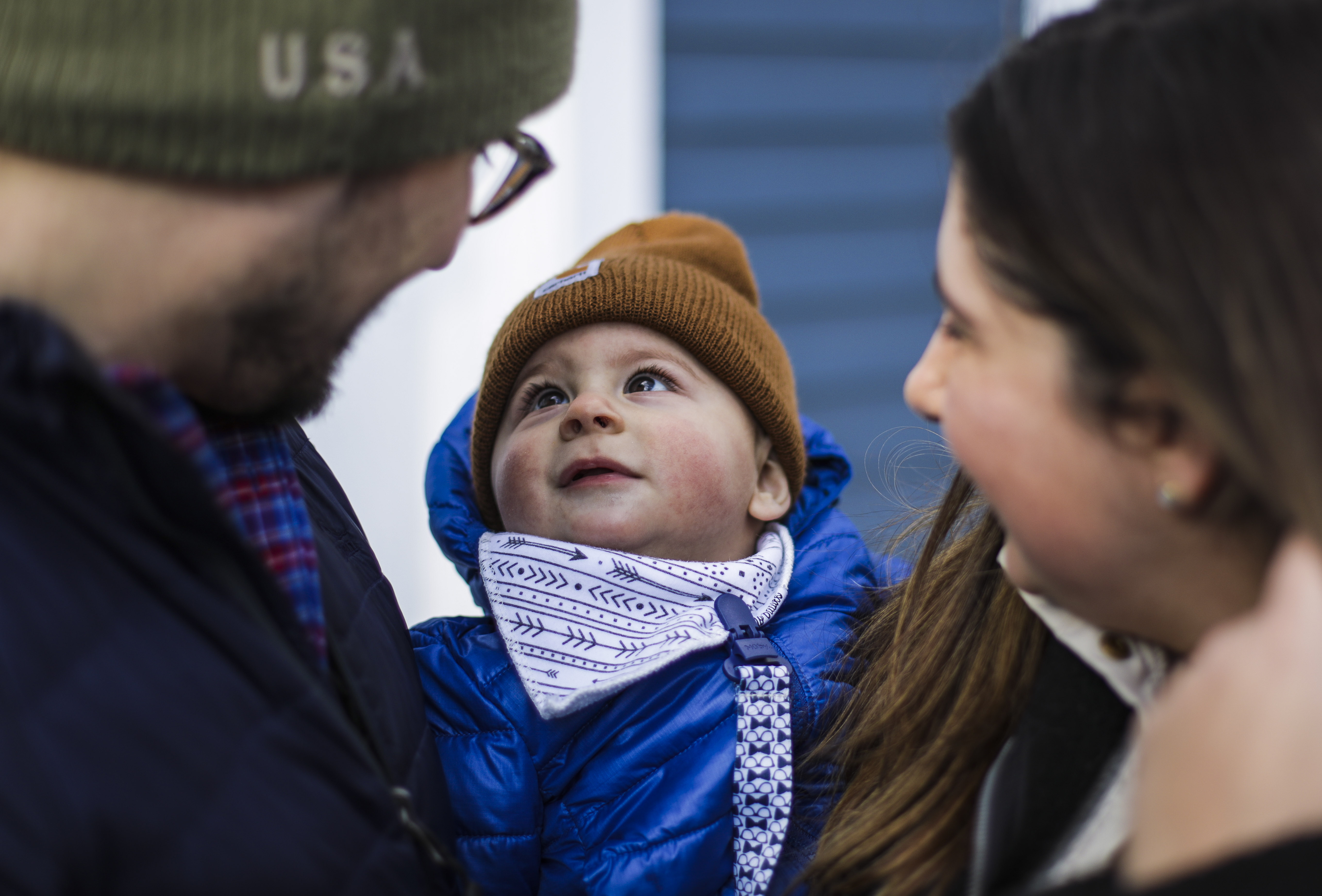 Ryder Orzeck looked up at his dad Eric Orzeck (left) and mom Alexis in North Andover.