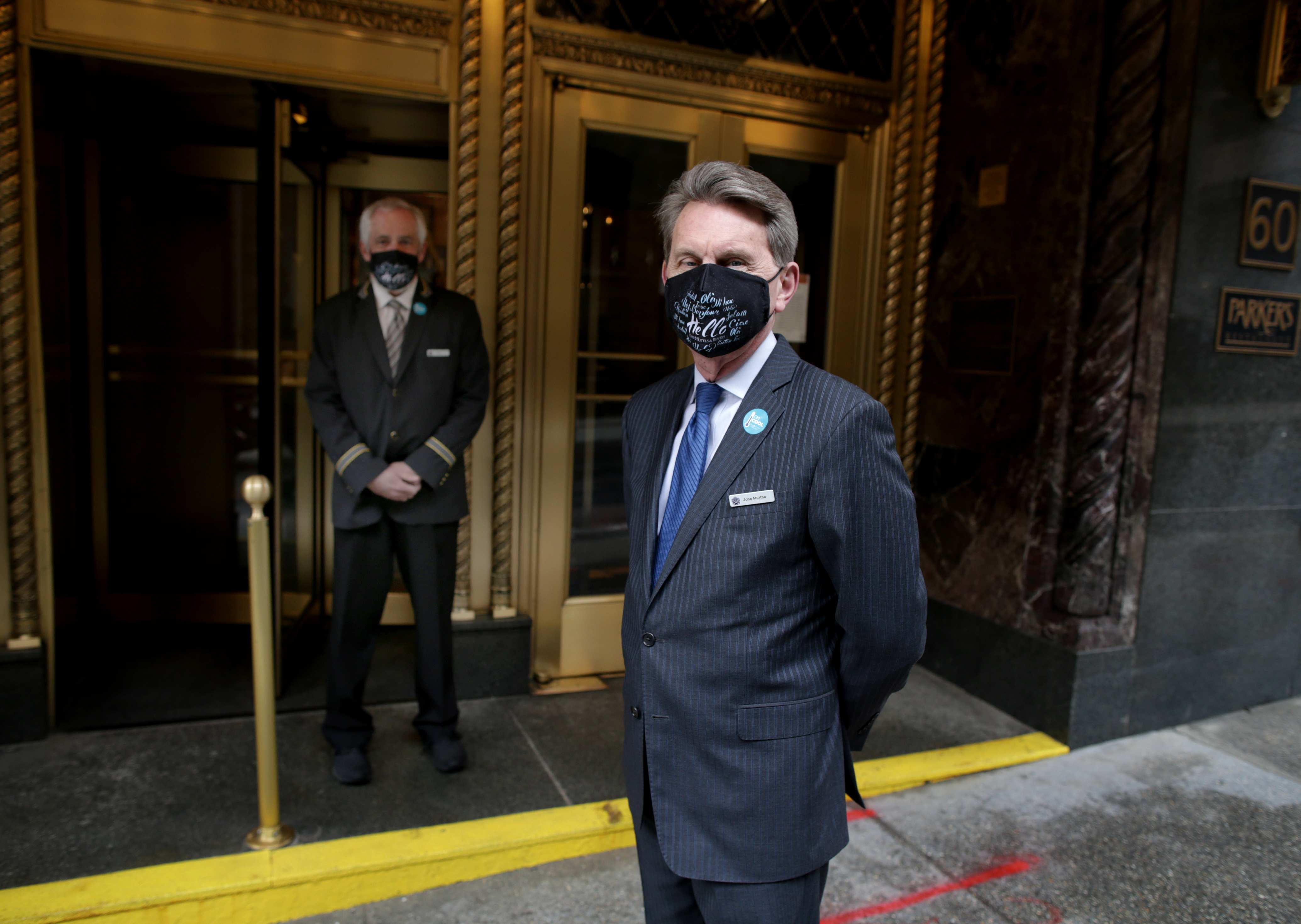 Longtime Boston Omni Parker House Hotel employee Dan McKenna (left), with general manager John Murtha in front of the hotel.