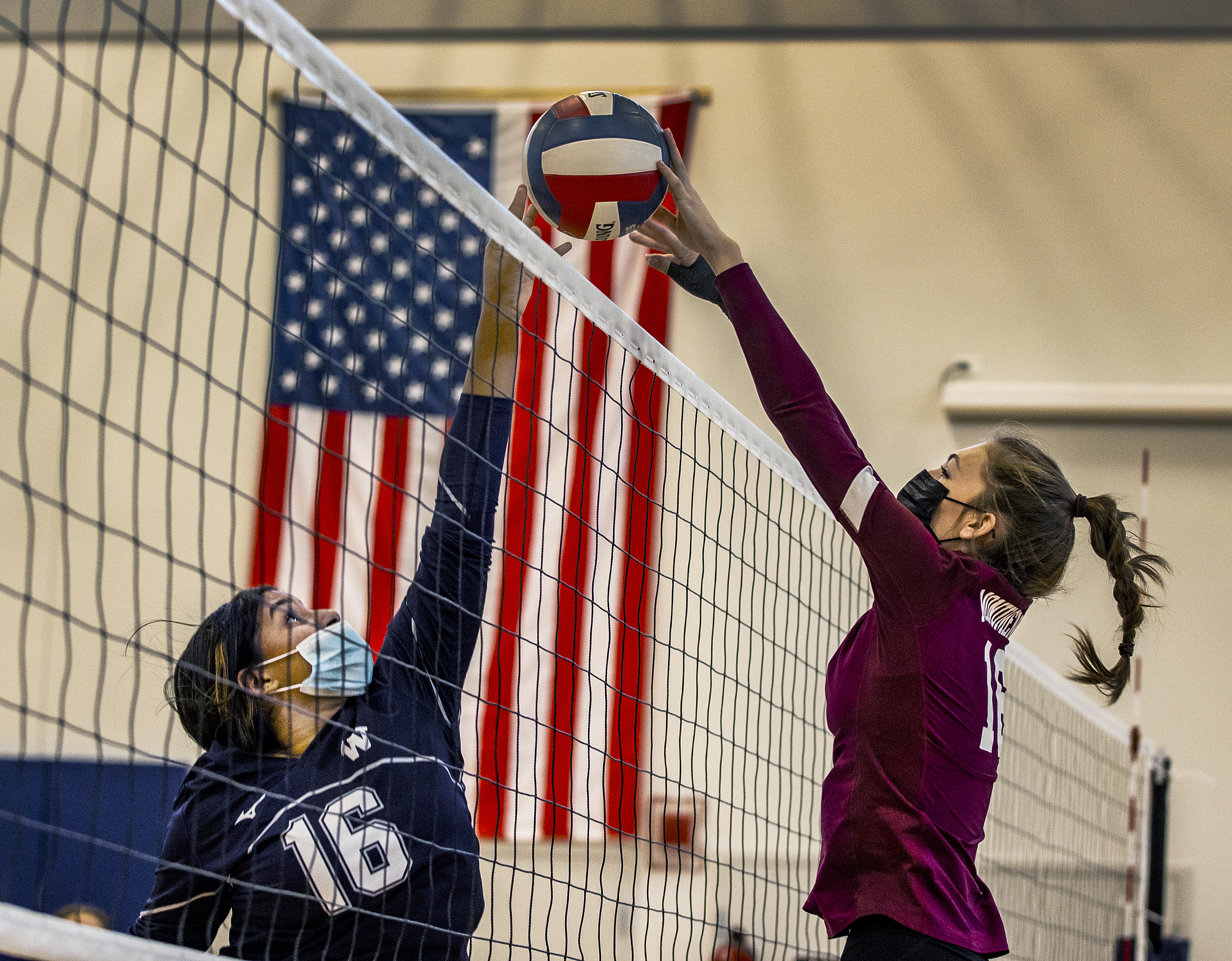 Nantucket's Addys Del Rosa (left) and Monument Mountain's Ava Barenski battle at the net.