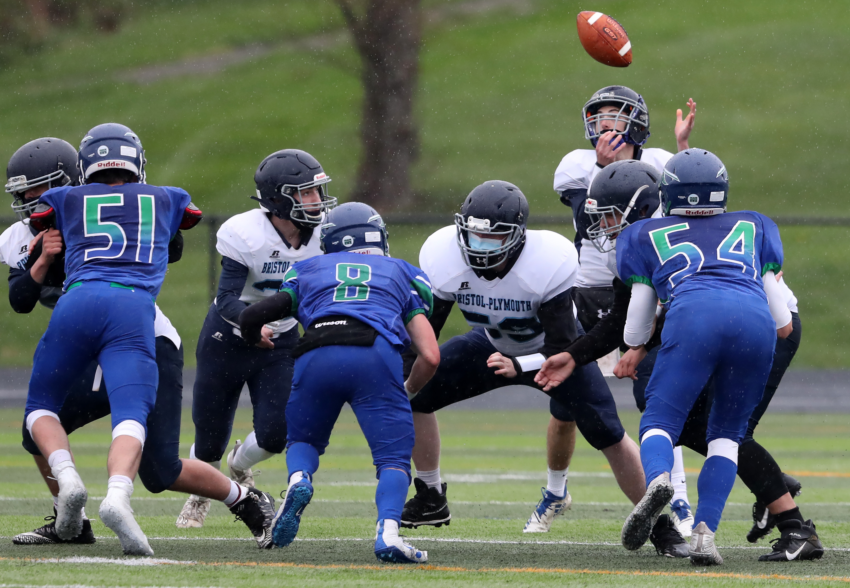 Bristol-Plymouth quarterback Sean Cochrane had trouble with a wet football as he took a first-quarter snap Thursday afternoon against Blue Hills Regional. He recovered the slick ball without a turnover.