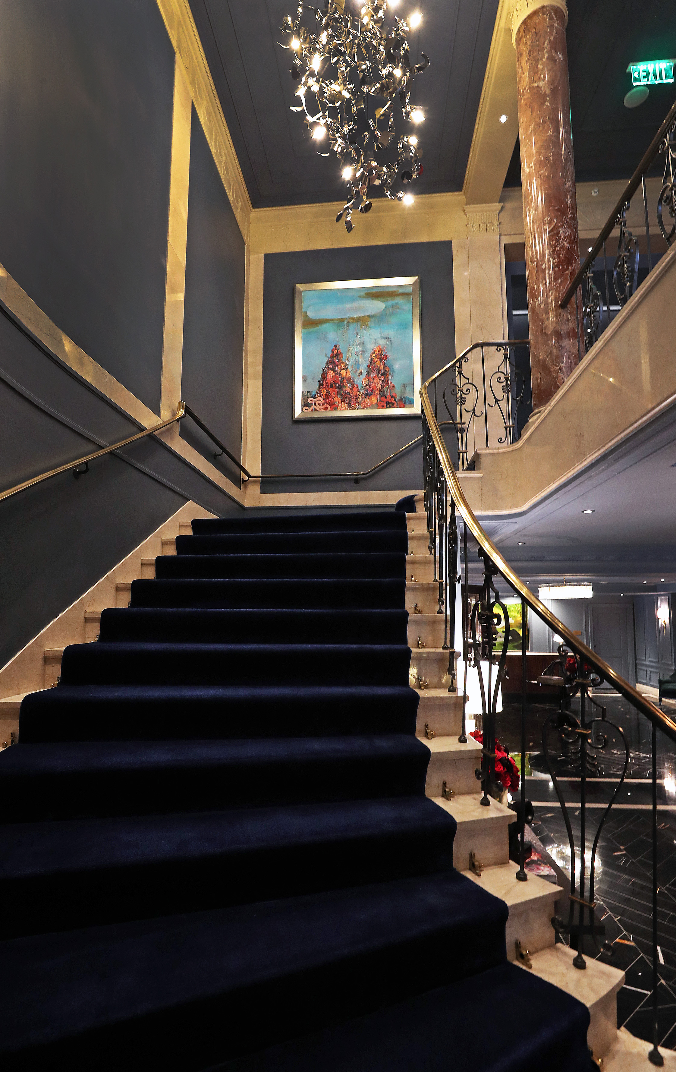 The staircase leading from the first floor lobby to the second floor.