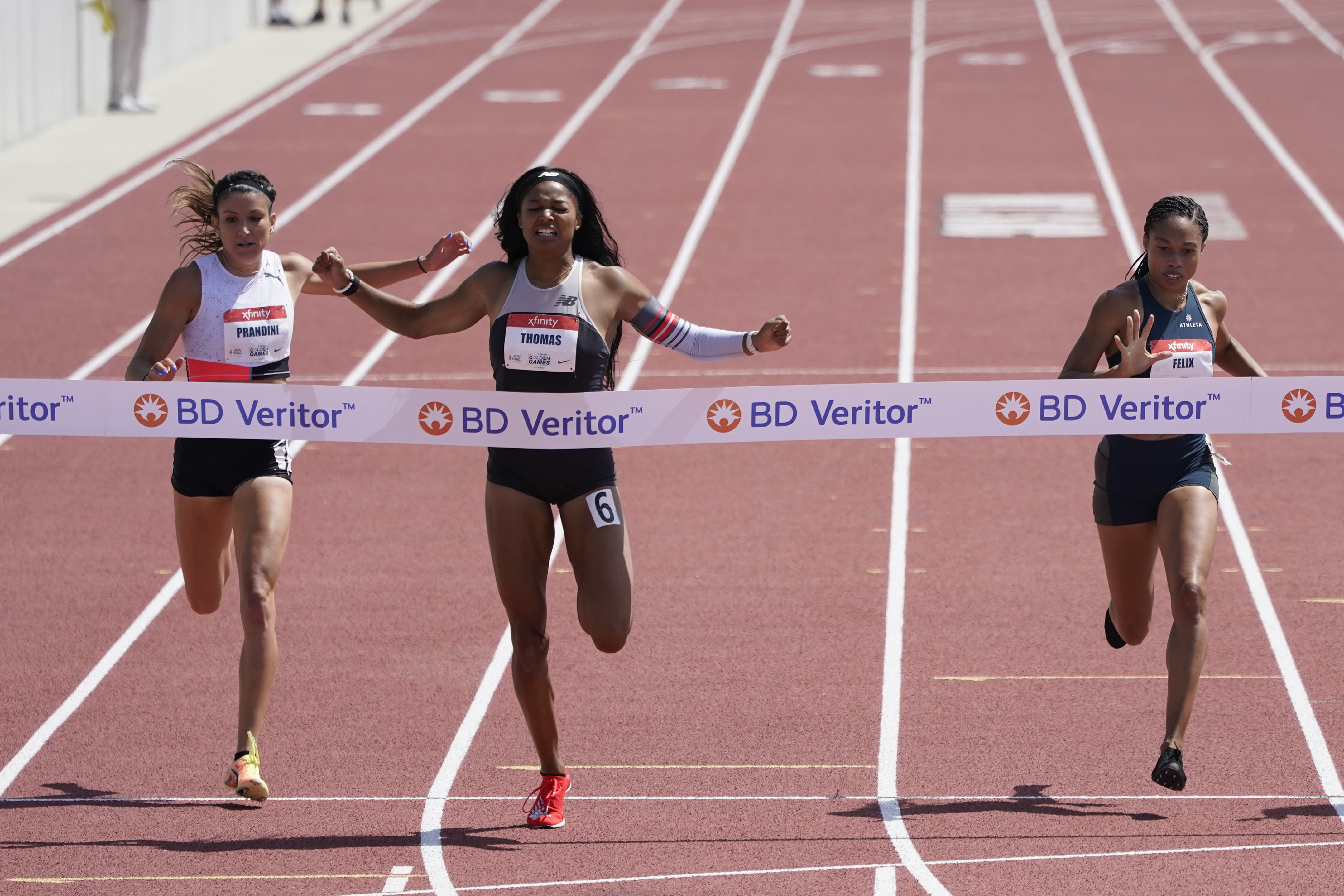 Gabby Thomas wins the women's 200-meter dash during the USATF Golden Games this past May.