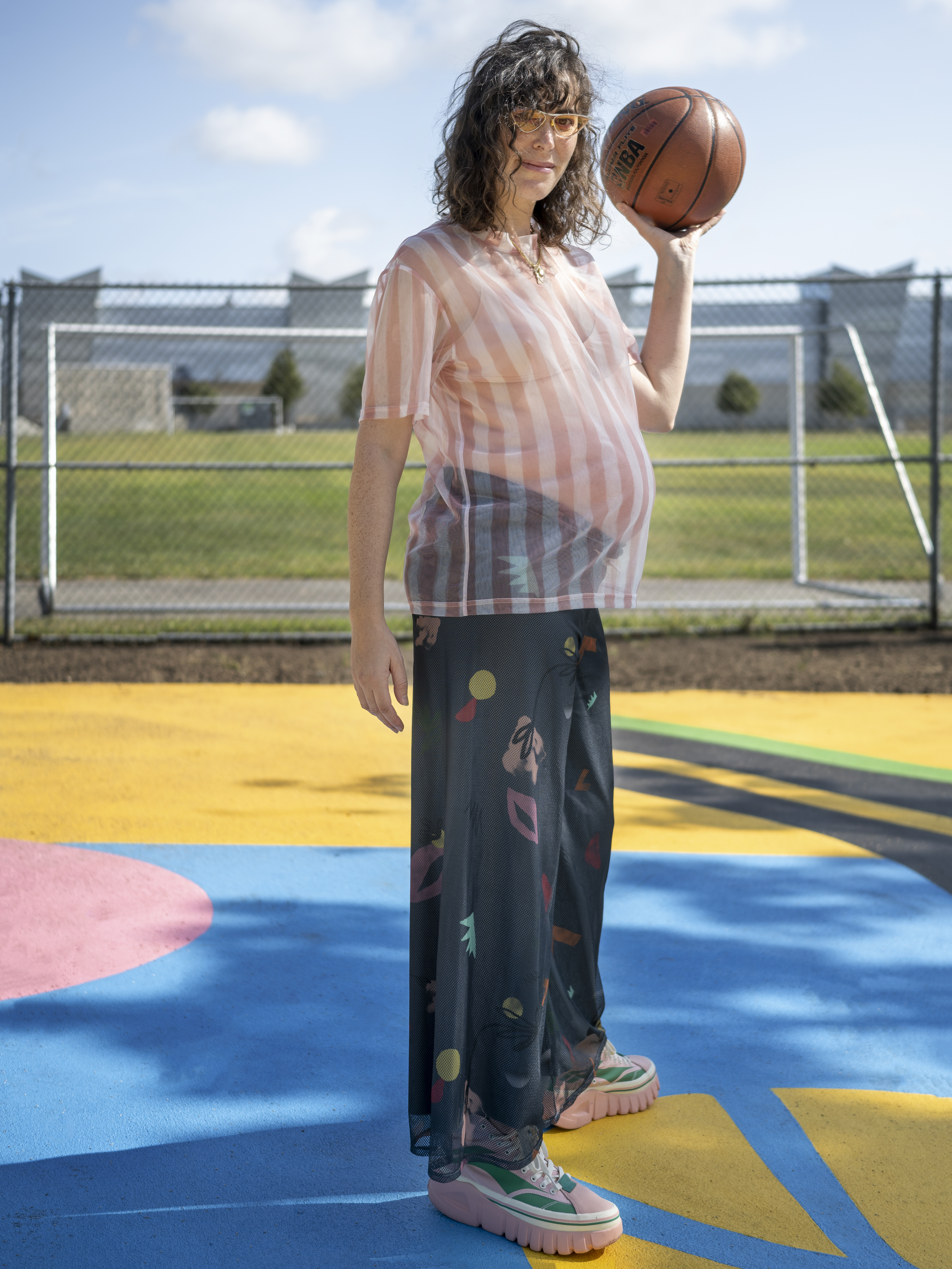 Artist Andrea Bergart on her basketball court mural.