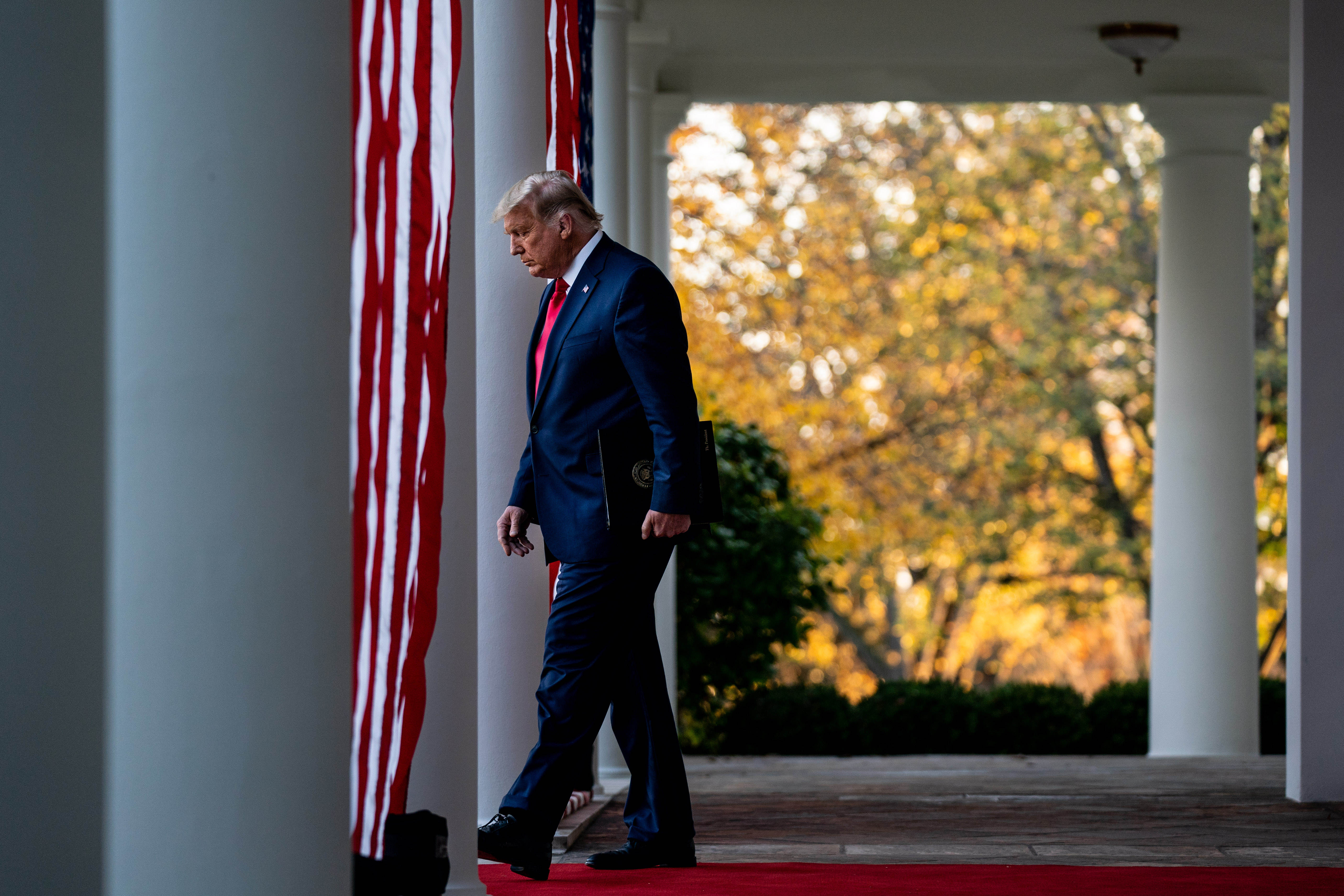 President Trump arrives to the Rose Garden to discuss progress on a coronavirus vaccine, at the White House on Nov. 13. (Anna Moneymaker/The New York Times)