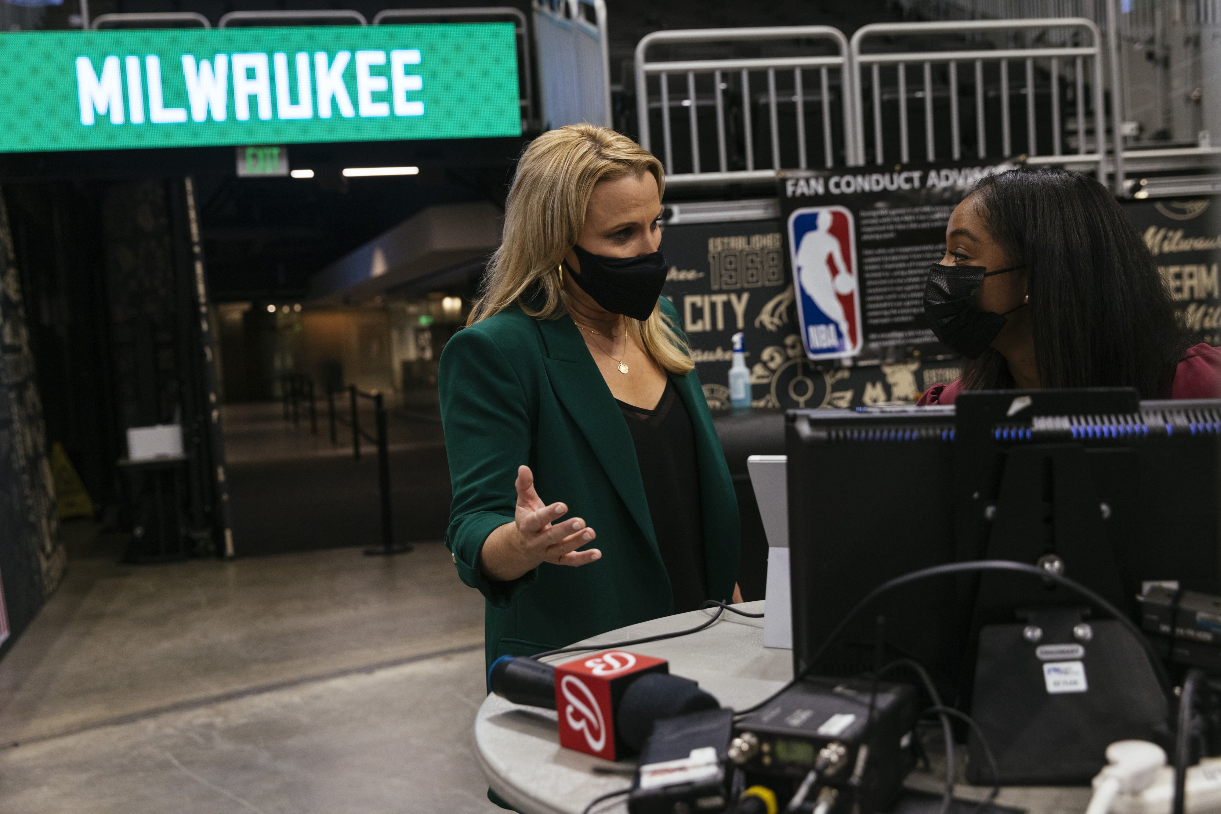 Lisa Byington, the first female full-time play-by-play broadcaster, talks with a reporter before a game between the Bucks and Thunder earlier this month.