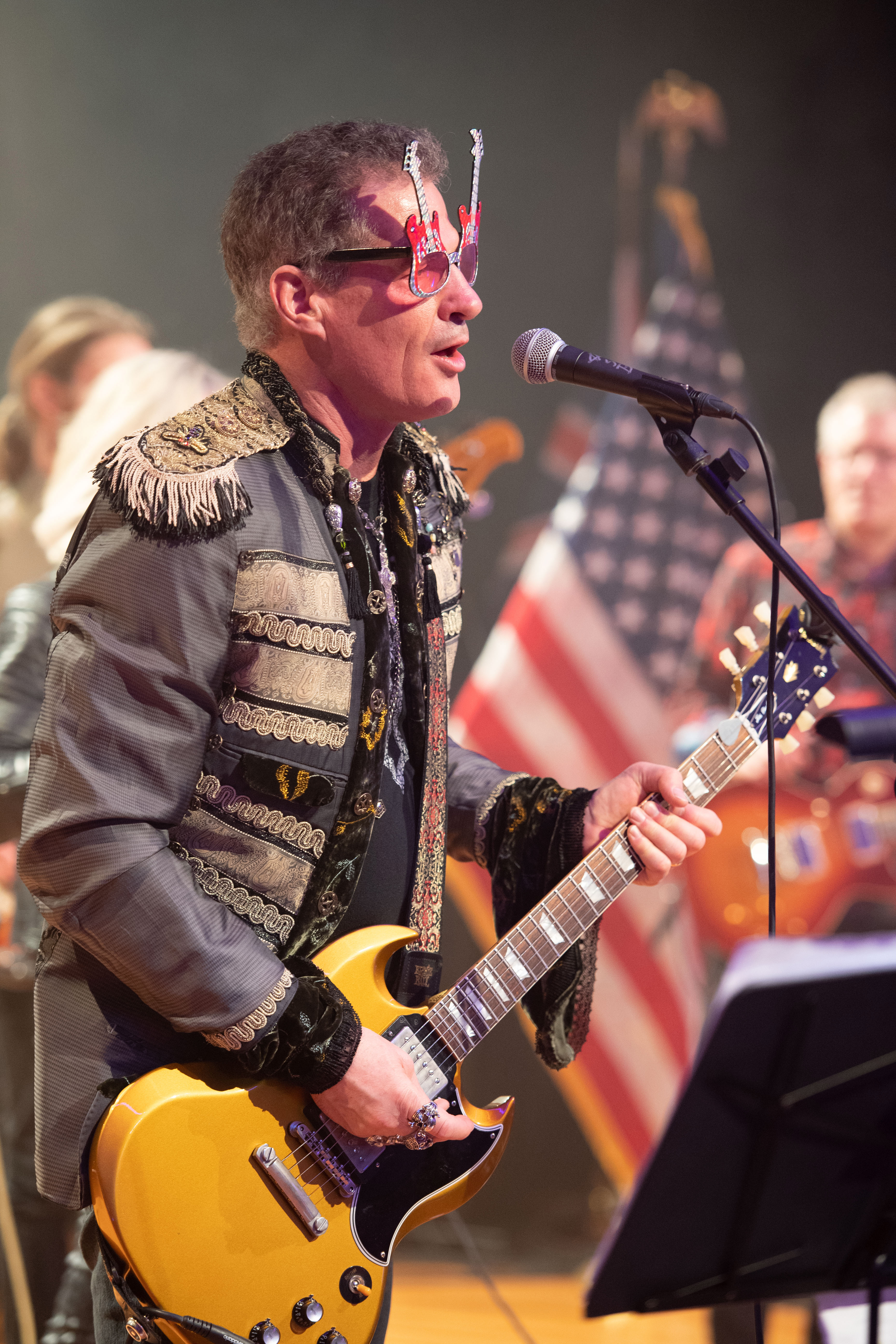 Ambassador Scott Brown celebrating through song at his embassy's Independence Day party.