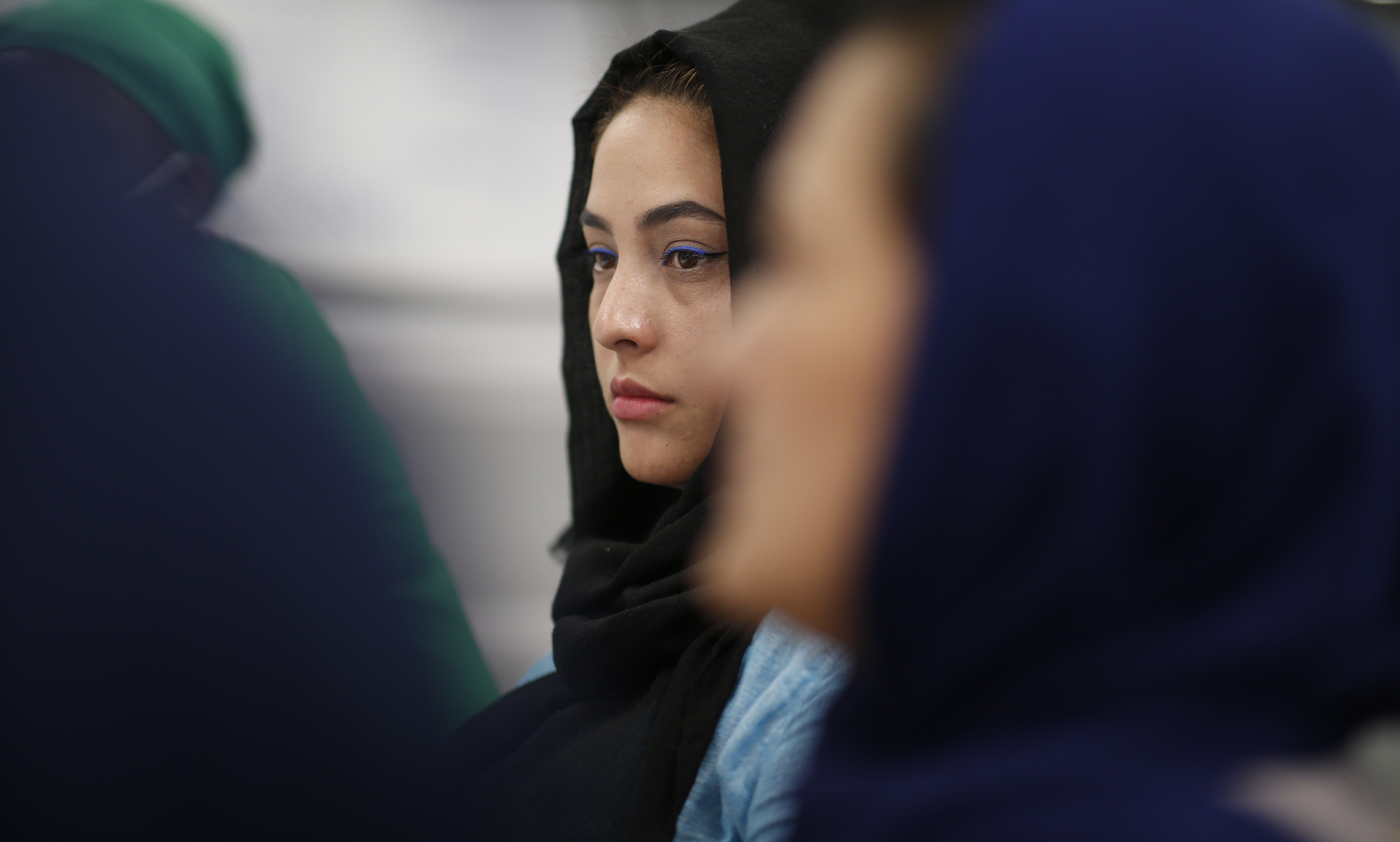Madina Sadat listens during a meeting at the Refugee Dream Center to prepare for welcoming those being evacuated from Afghanistan.