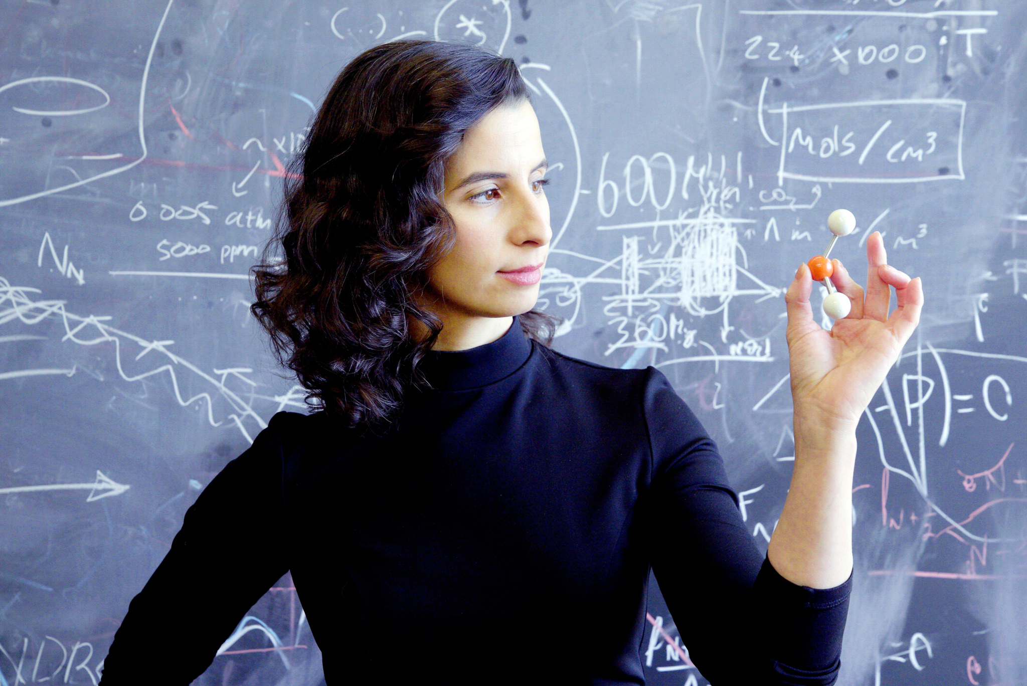 Clara Sousa-Silva, one of the authors of a stunning paper saying there may be signs of life in the clouds of Venus, is shown holding a model of the molecule phosphine.