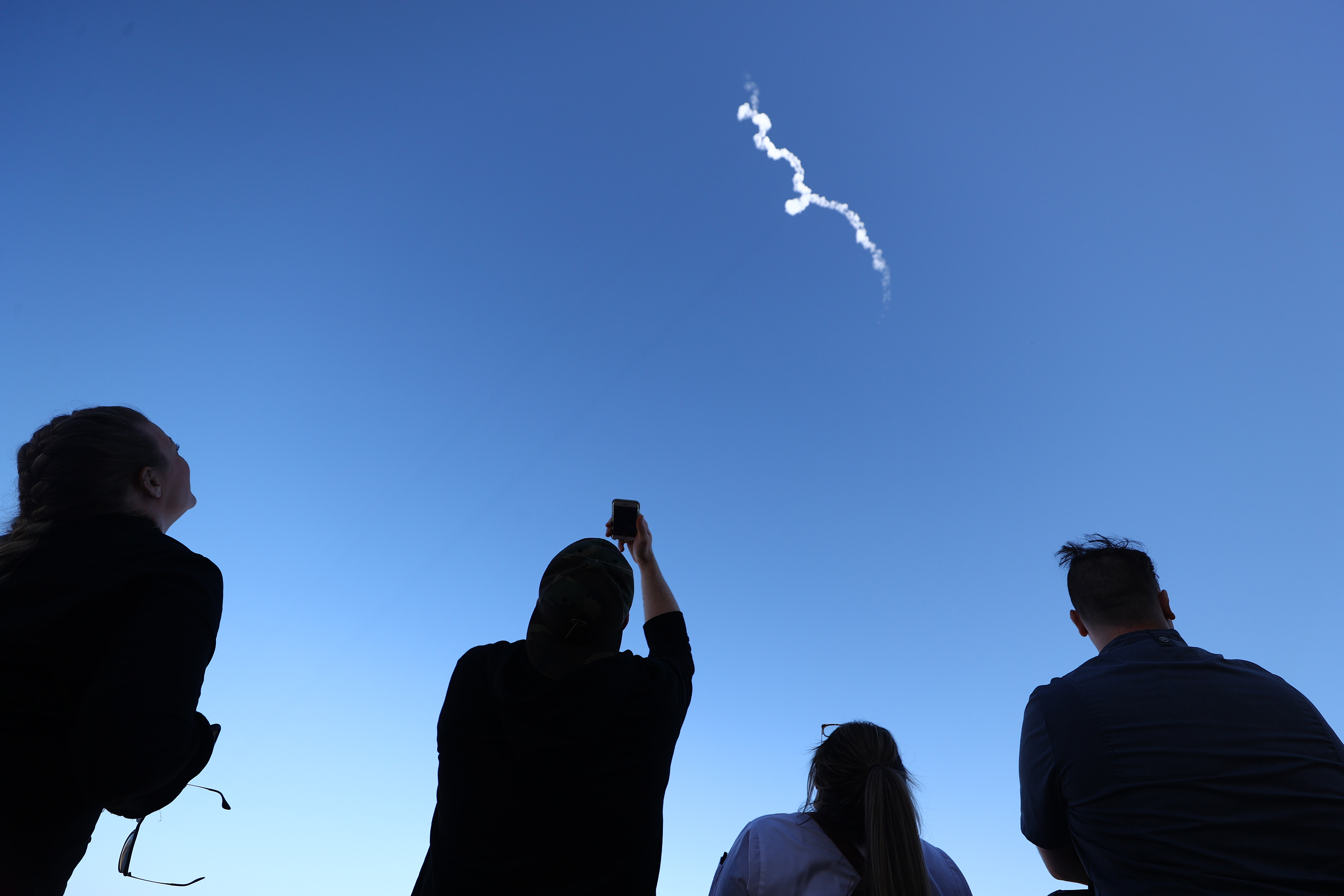 People watched as Blue Origin’s New Shepard flew toward space carrying 90-year-old Star Trek actor William Shatner and three other civilians near Van Horn, Texas.