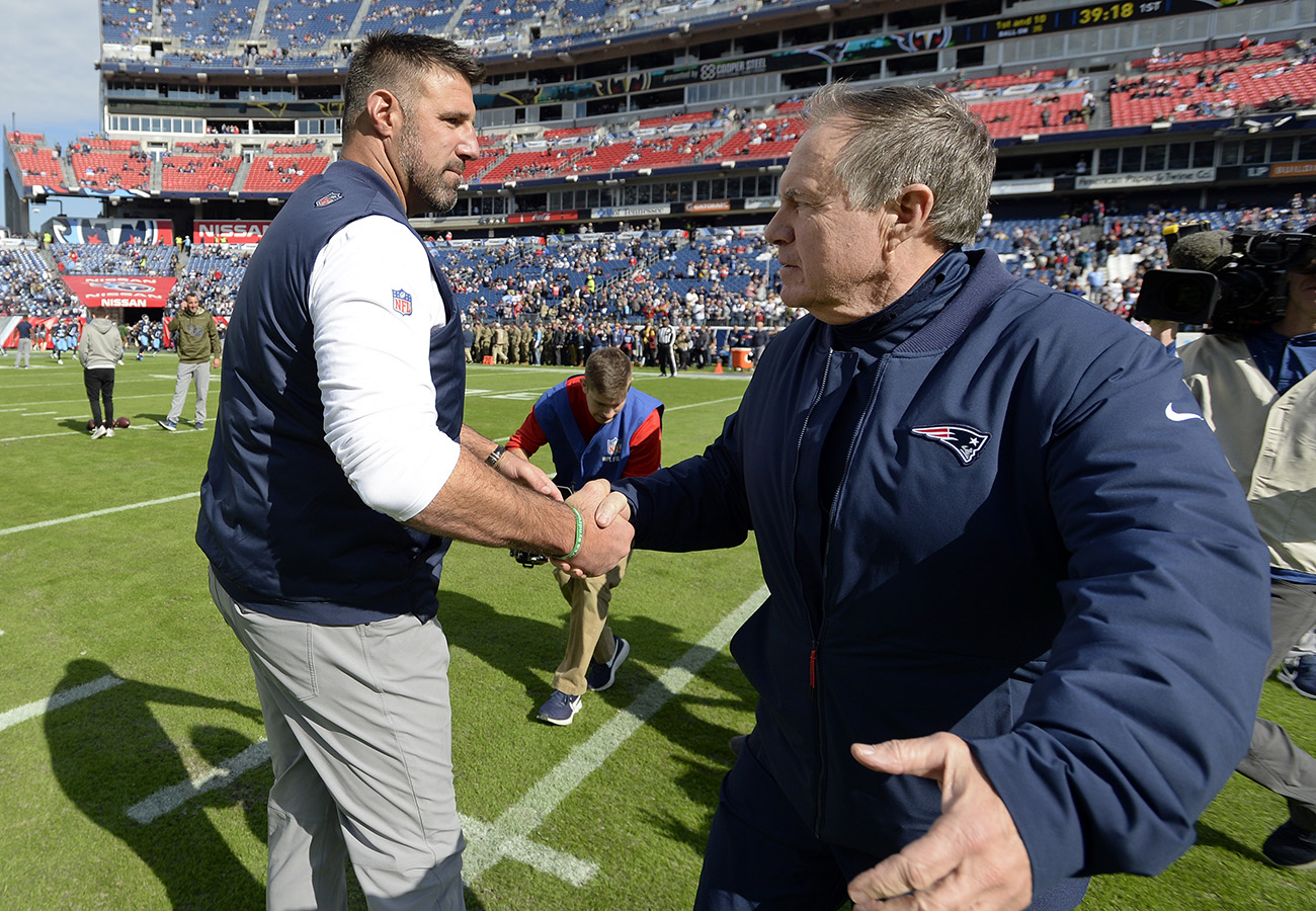 Mike Vrabel and Bill Belichick shake hands after a New England-Tennessee game in 2018.