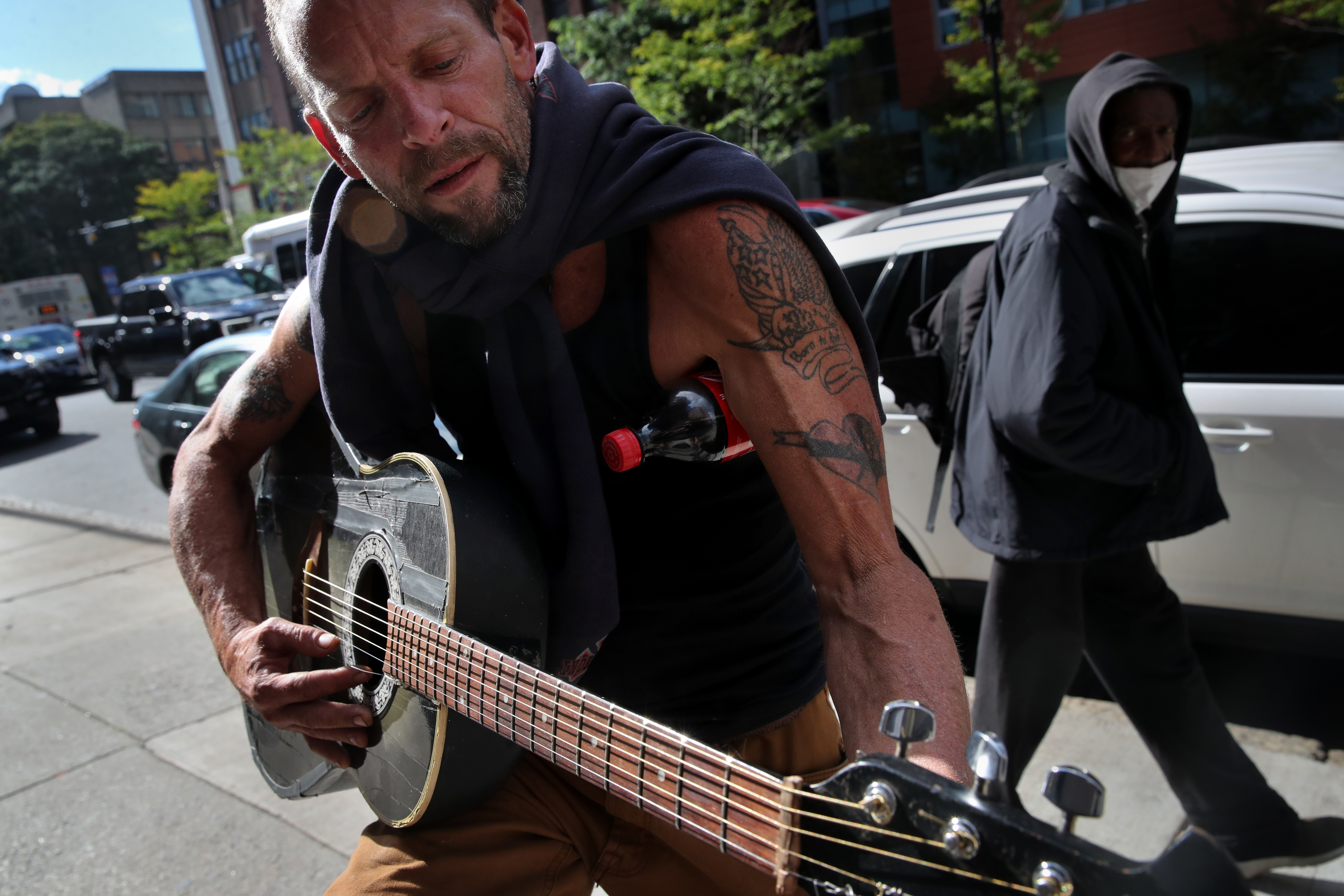 Joe Golden played his guitar on Albany Street.