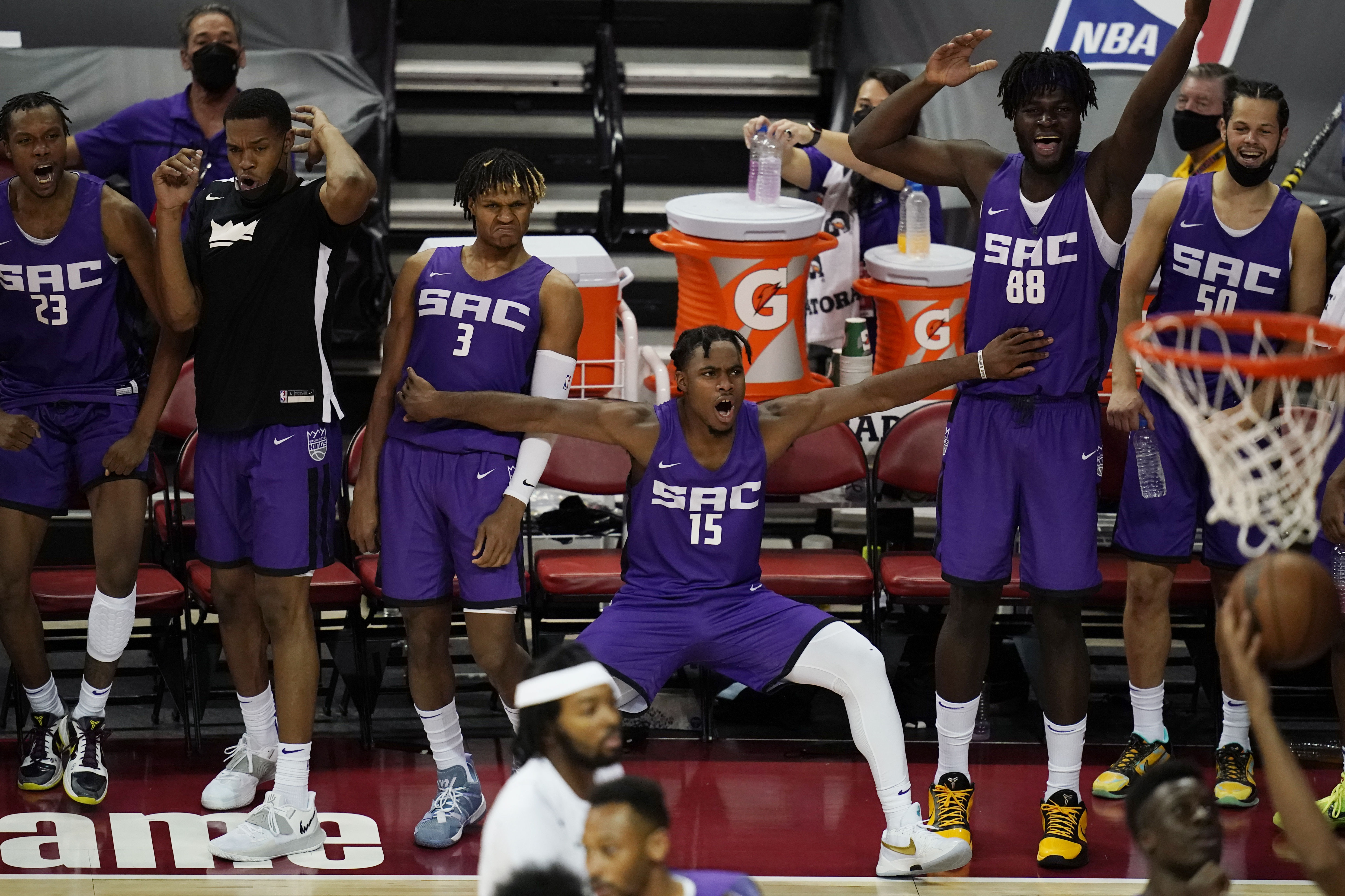 The Sacramento bench reacts in the final minutes of Tuesday's blowout of the Celtics.