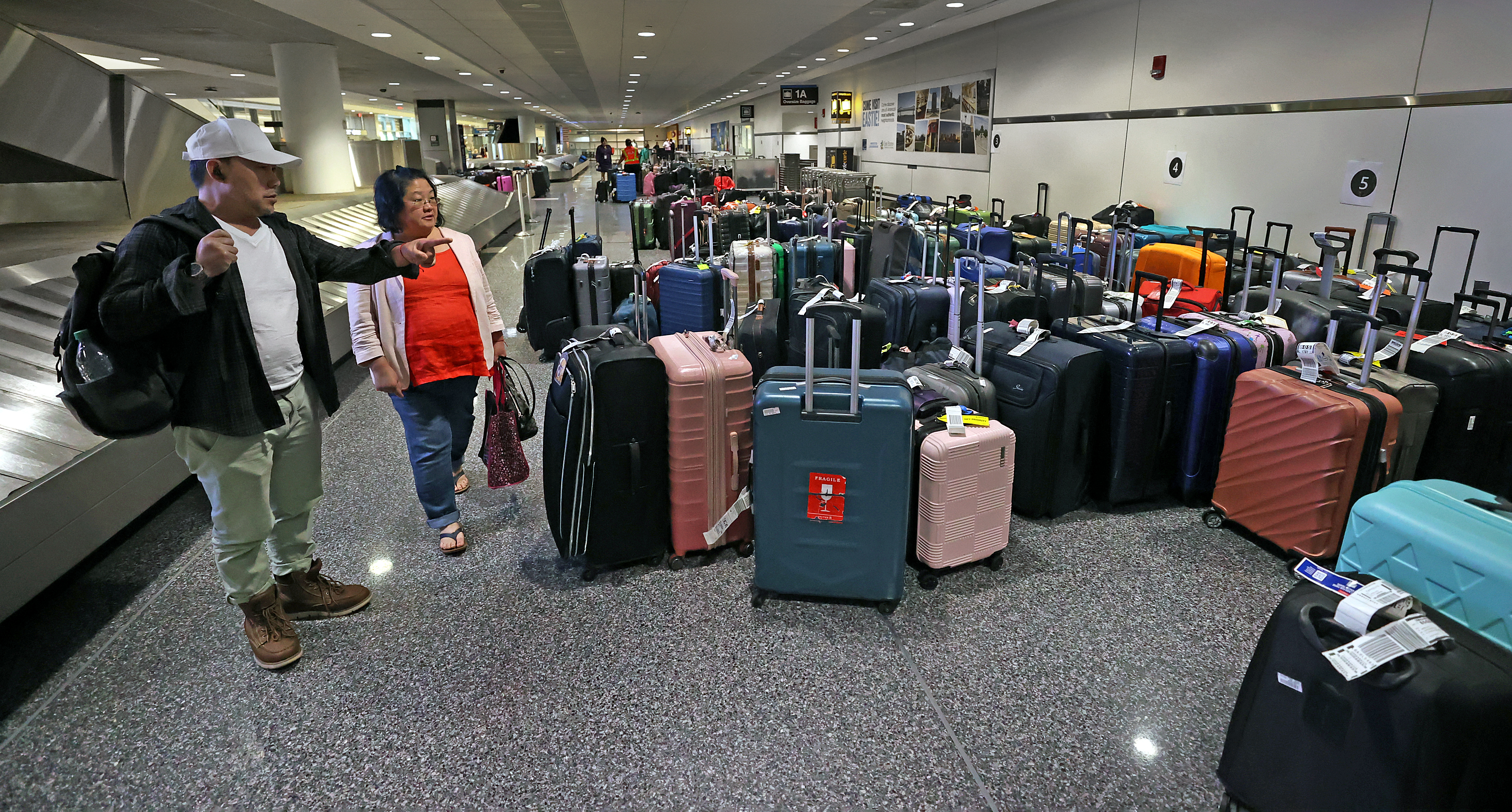 Delta travelers at Logan struggle to find luggage rebook flights days after outage