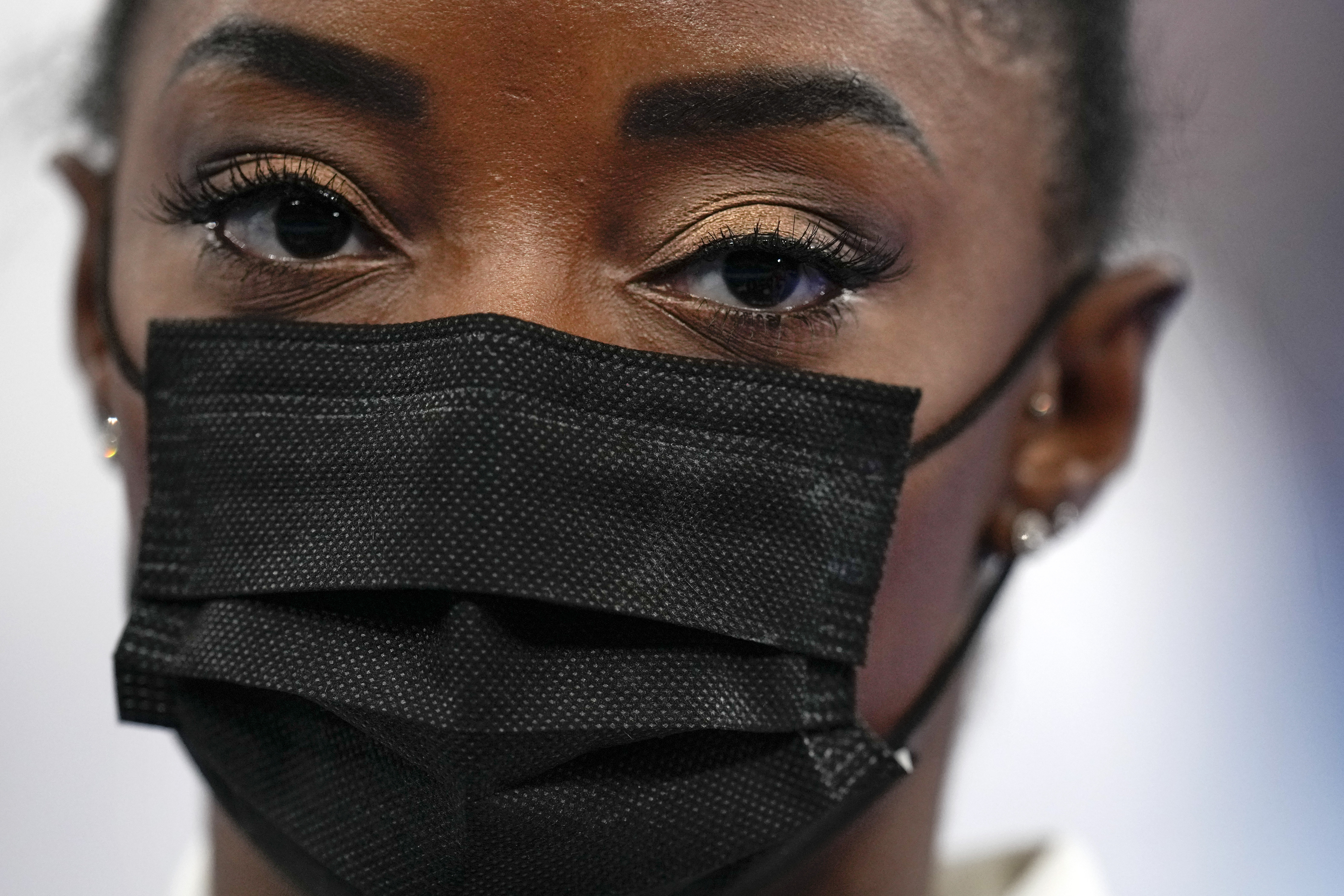 Simone Biles looks on after pulling out of the artistic gymnastics women's final earlier this week.