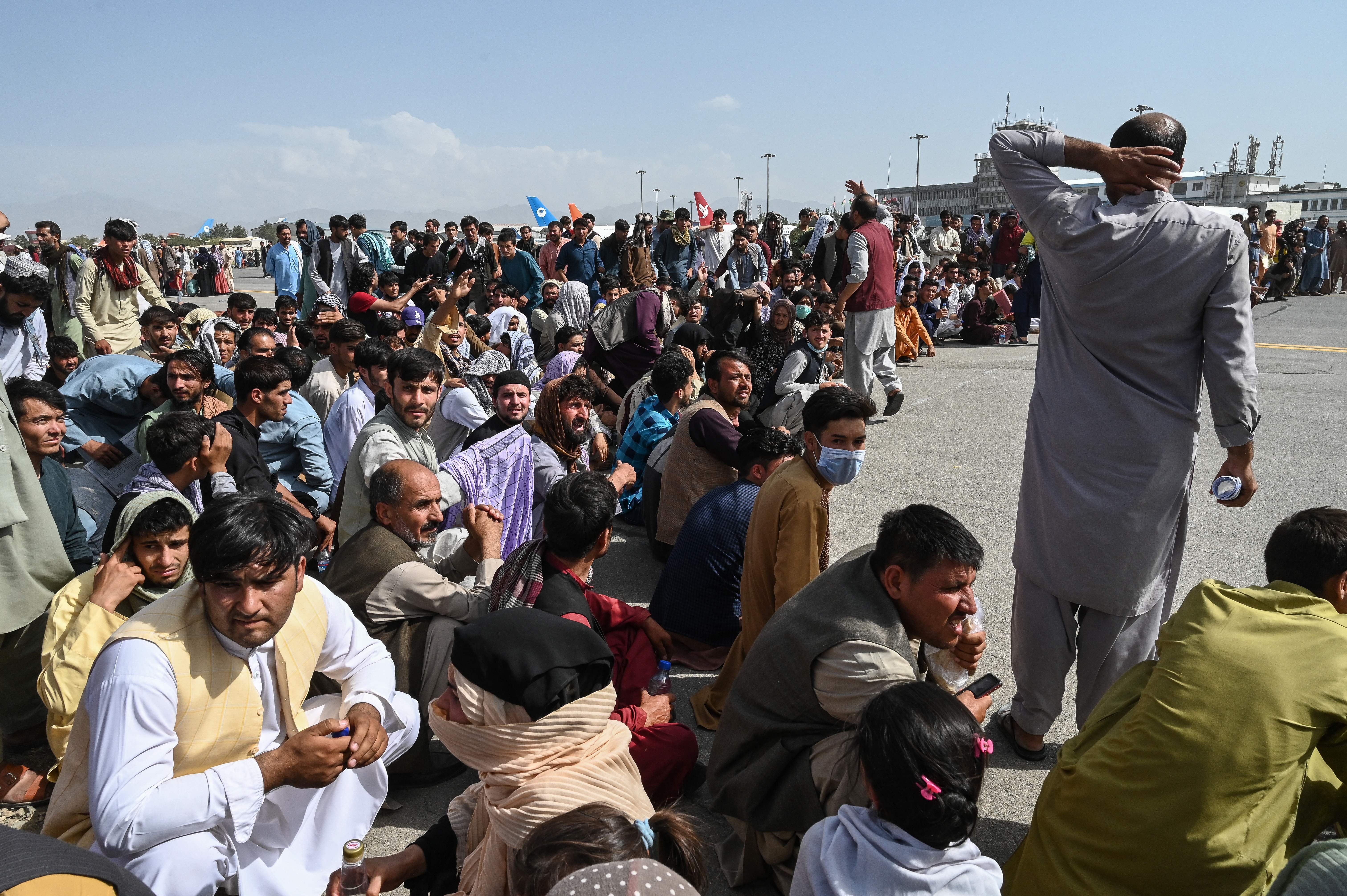 Afghan passengers waited to leave the Kabul airport.