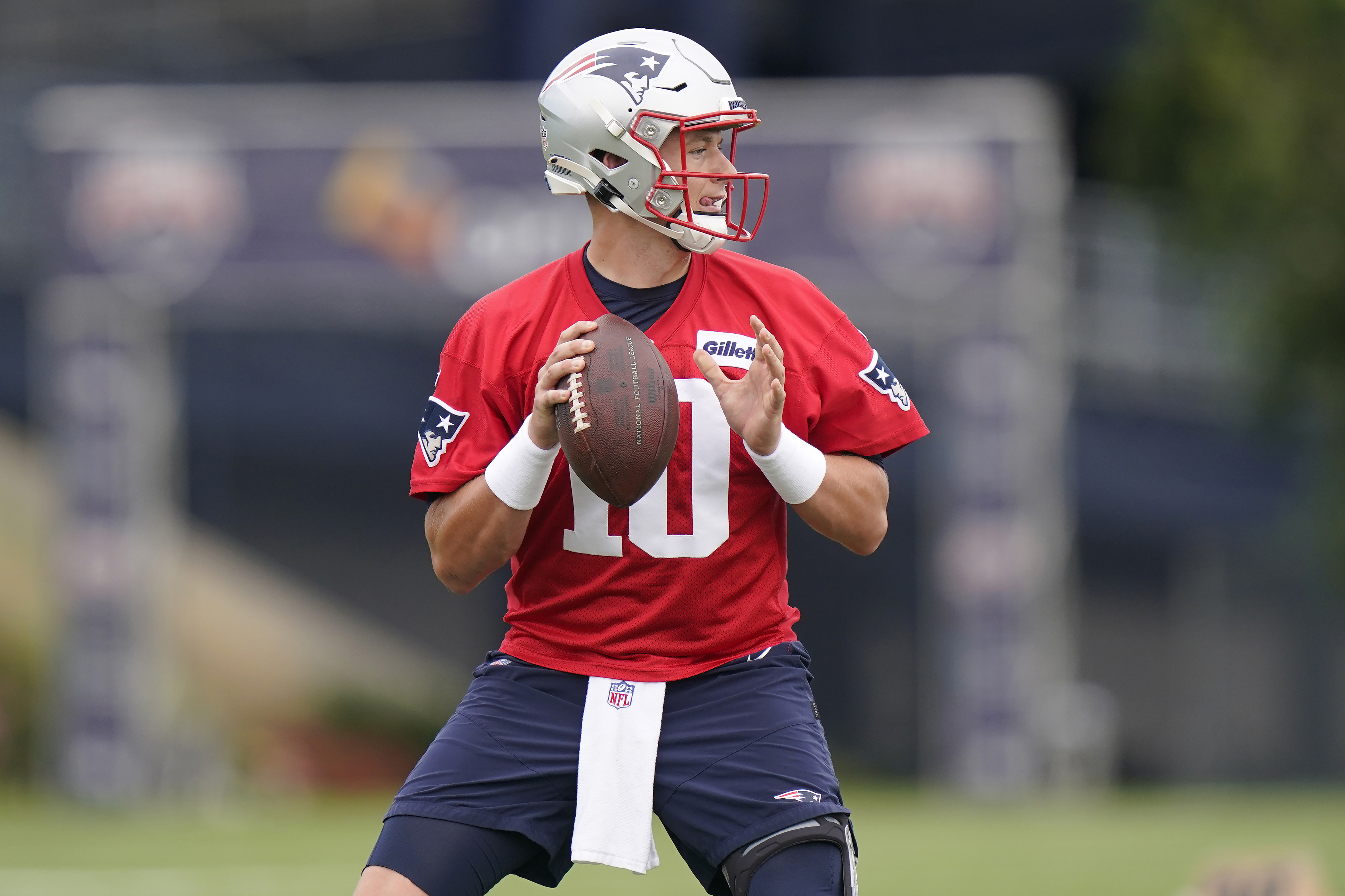 Mac Jones looks for a receiver during practice Tuesday in Foxborough.