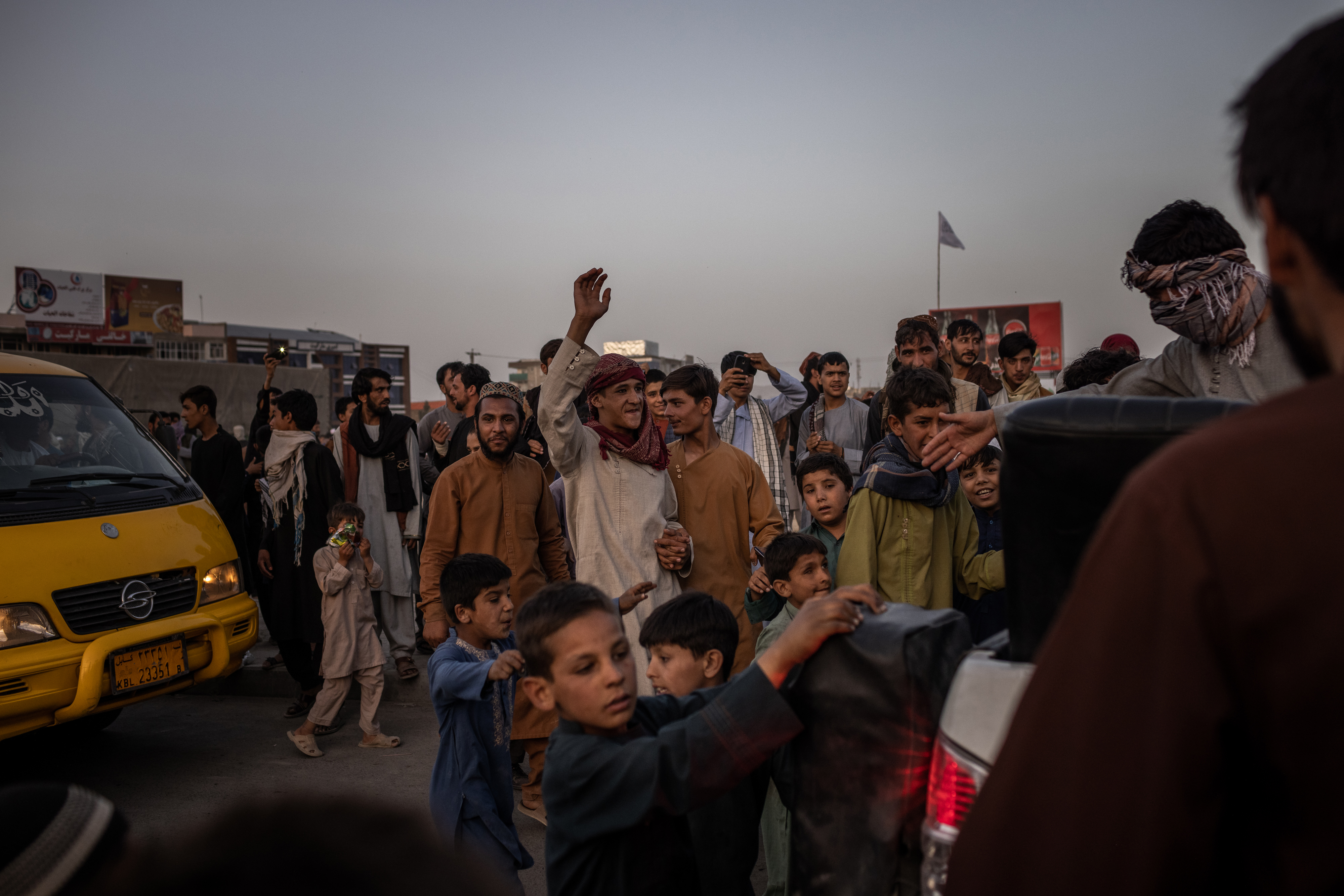 Residents greeted Taliban fighters in Kabul on Sunday.