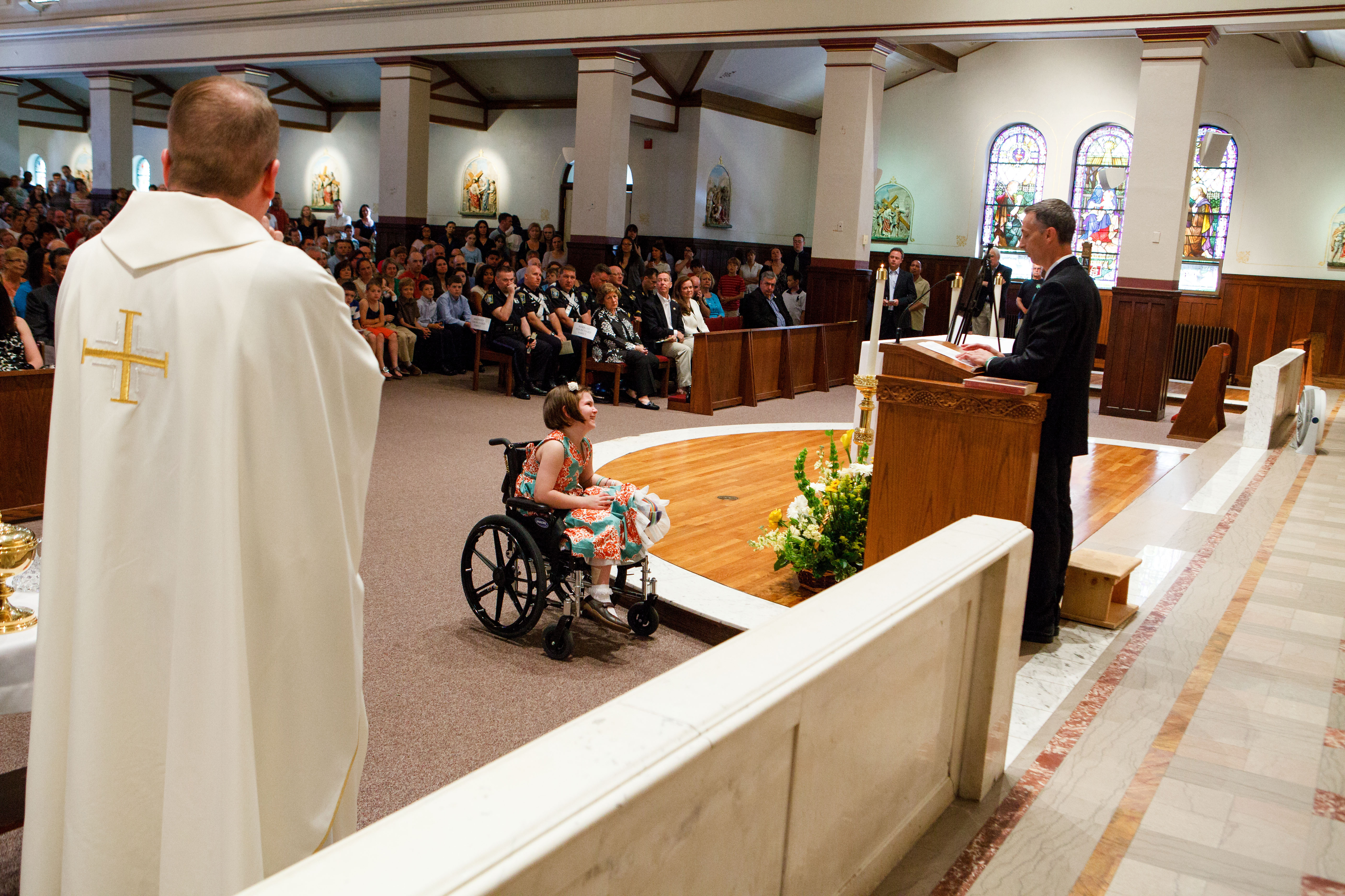 A SMILE PARTS THE CLOUDS: As Bill Richard stepped up to the pulpit during a memorial Mass for Martin in June, Jane made funny faces at her father while he spoke.
