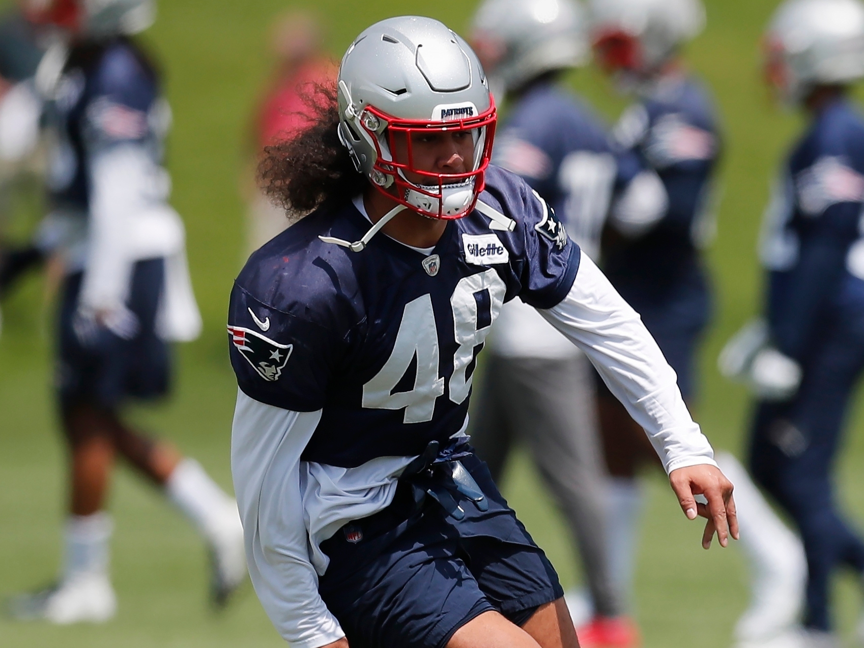 New England Patriots linebacker Jahlani Tavai (48) walks on the sidelines  during an NFL football game against the Miami Dolphins, Sunday, Jan. 9,  2022, in Miami Gardens, Fla. (AP Photo/Doug Murray Stock