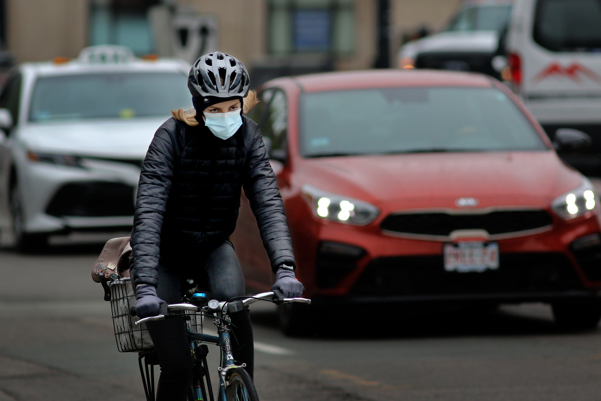 A woman rode her bike in Brookline.