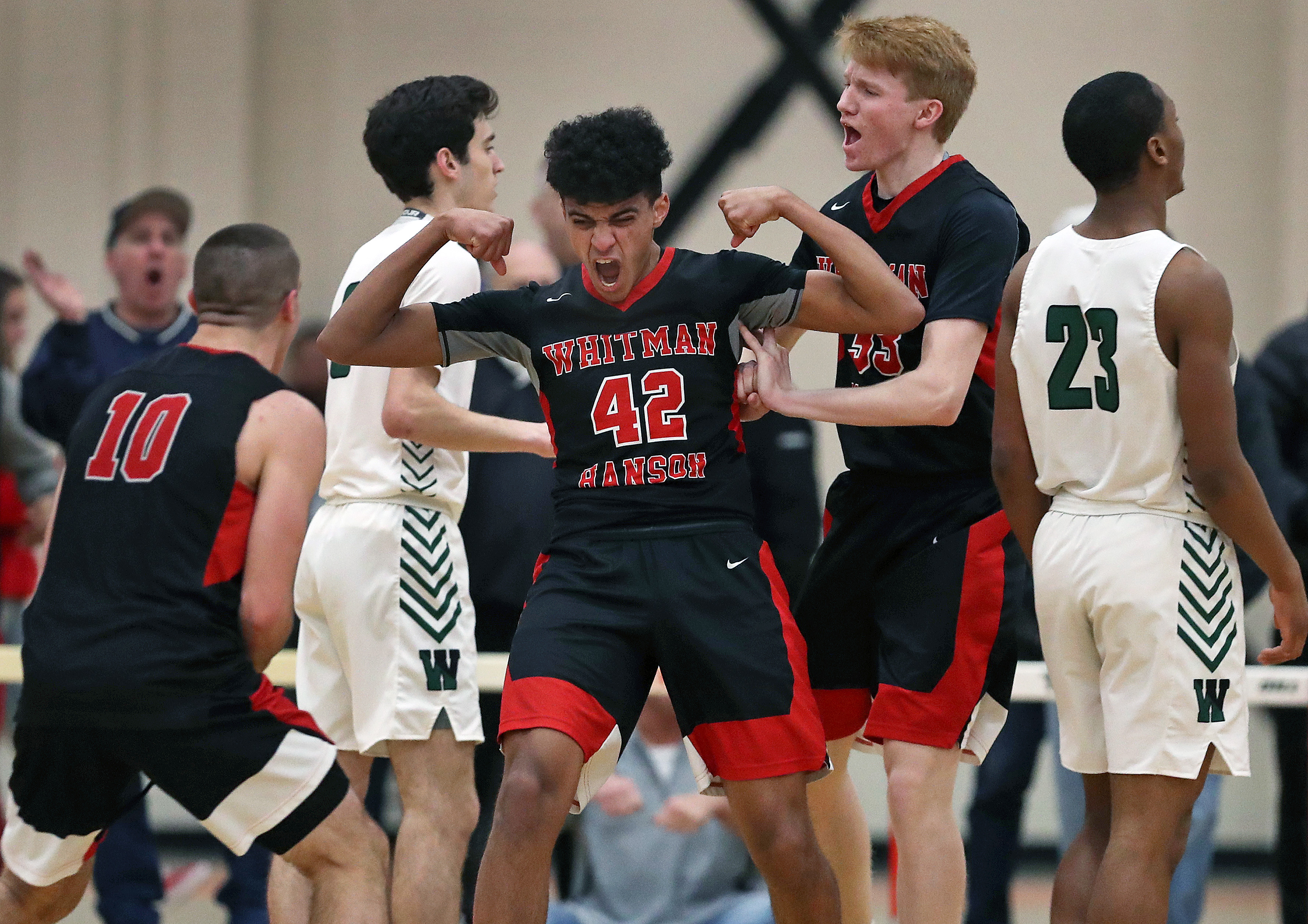 Whitman-Hanson’s Nate Amado flexed after he hit a third-quarter shot that put his team ahead of Westwood in the Division 2 South boys’ basketball semifinal on March 4 in Taunton.