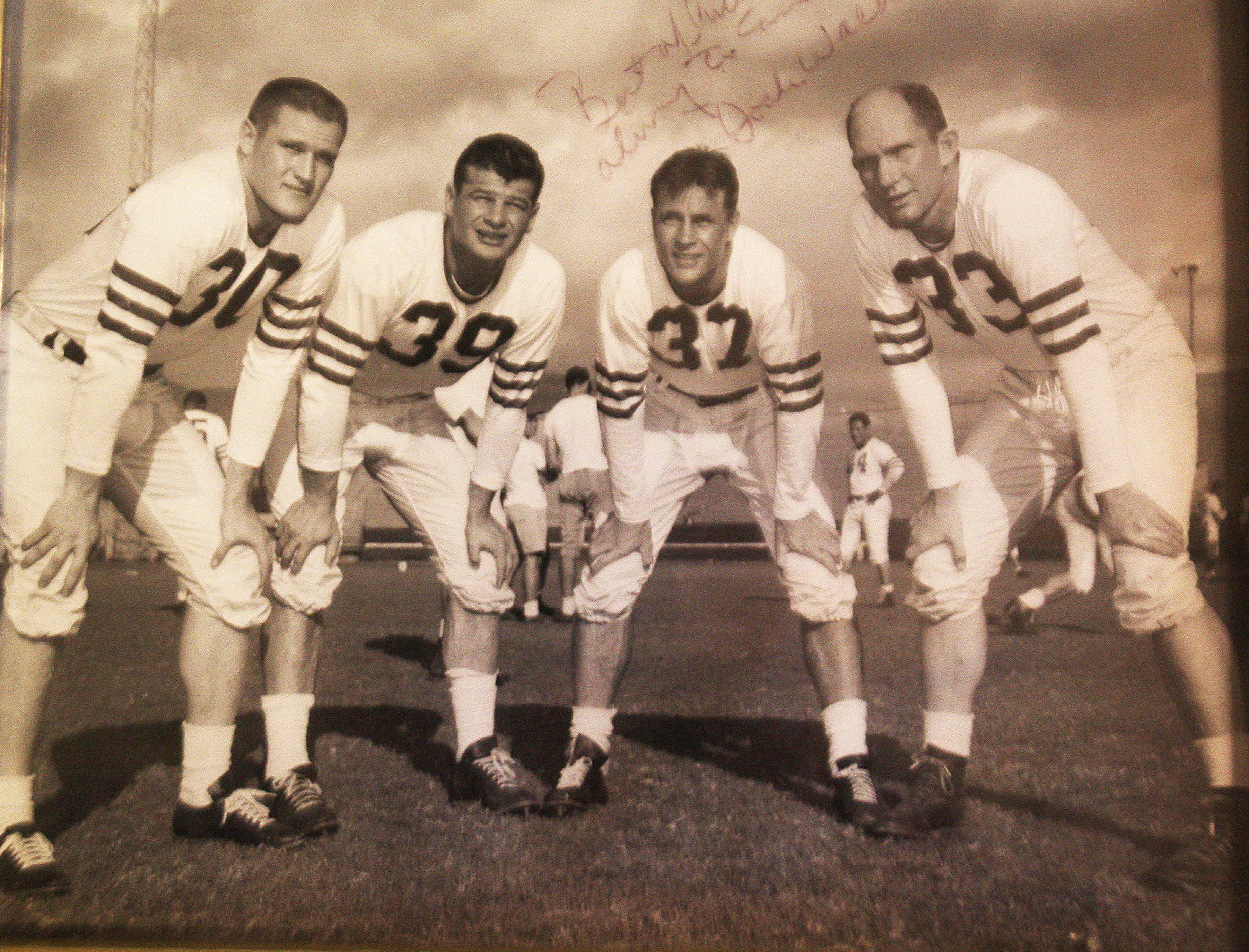 Mr. Hardy (left), with Hall of Famers Y.A. Tittle (right) and Hugh McElhenny (second from left).