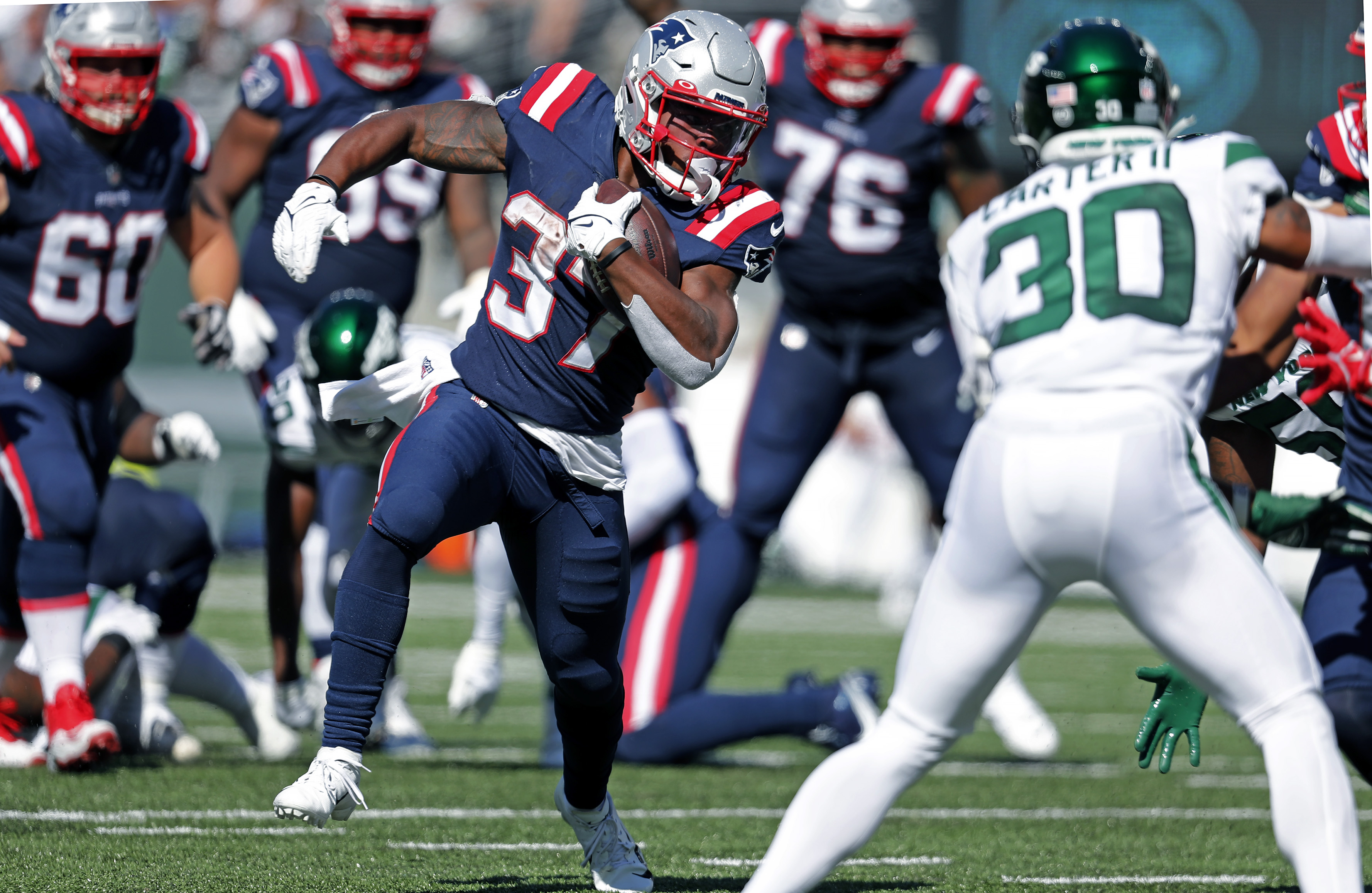 New England Patriots running back Damien Harris (37) tries to