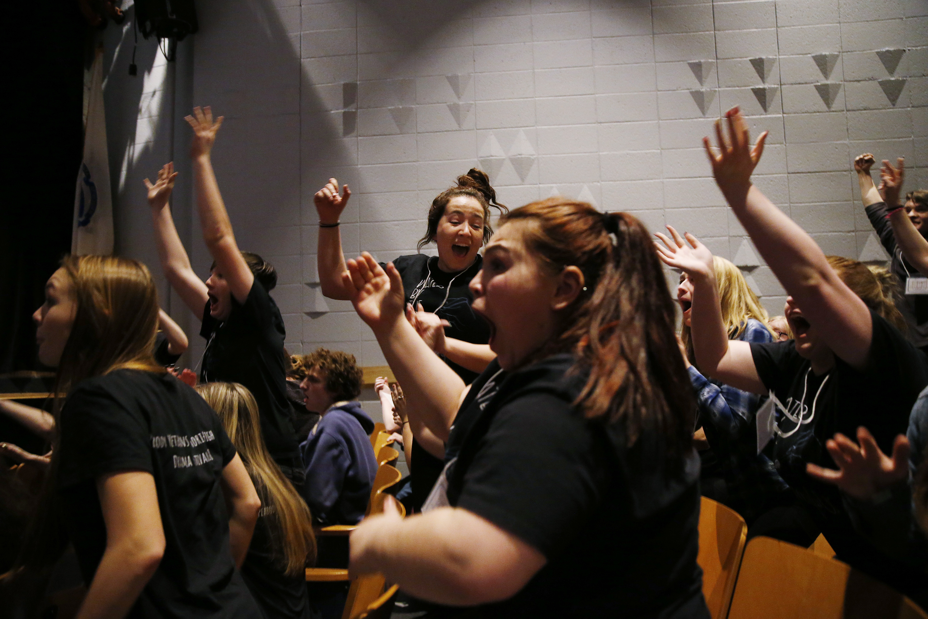 Deb (center) and the rest of the members of Stage One learned their play was selected to advance to finals during semifinals at Hamilton-Wenham Regional High School.