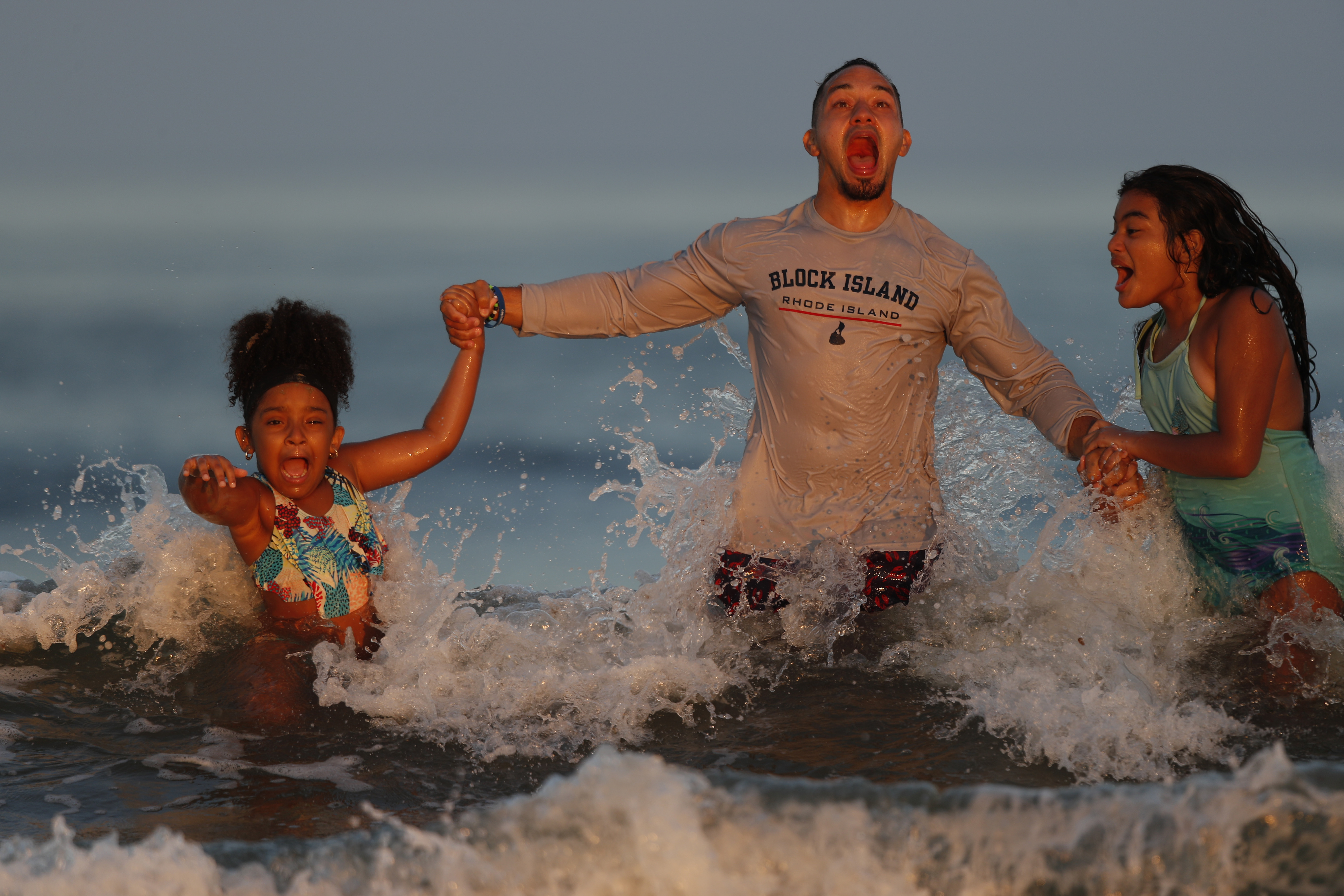 Eddie Miranda and his daughters, Niya (left) and Eva, at Old Orchard Beach, Maine, last August.