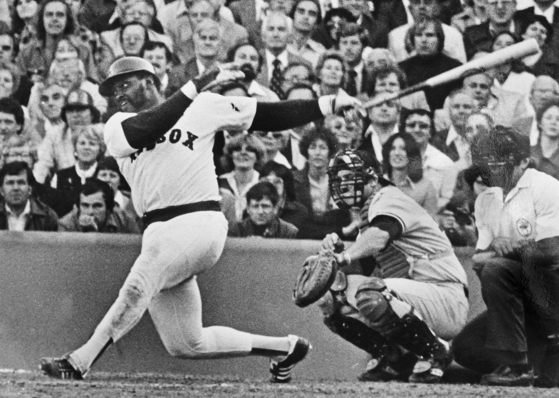 George Scott, shown in 1978, wore a batting helmet at the plate and on the field because of the hate from opposing fans.