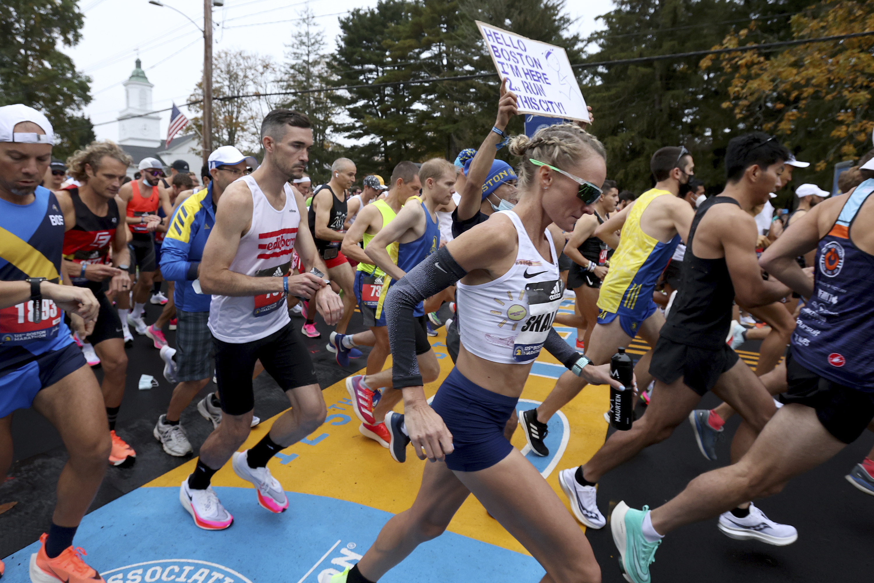 Massachusetts native Shalane Flanagan crosses the starting line Monday in Hopkinton.