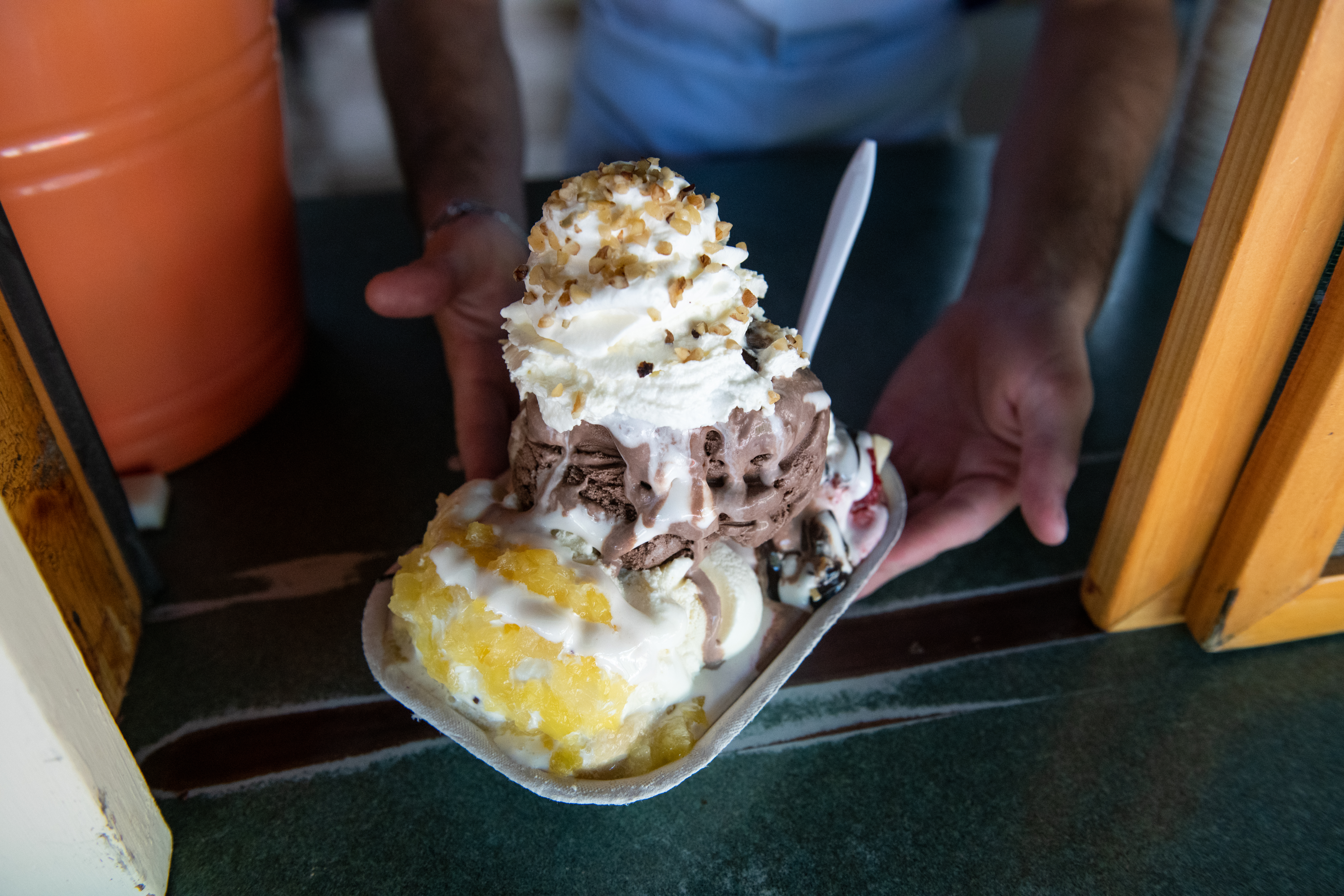 Kimball Farm's signature banana split ice cream, prepared by scooper Sam Jacobson.