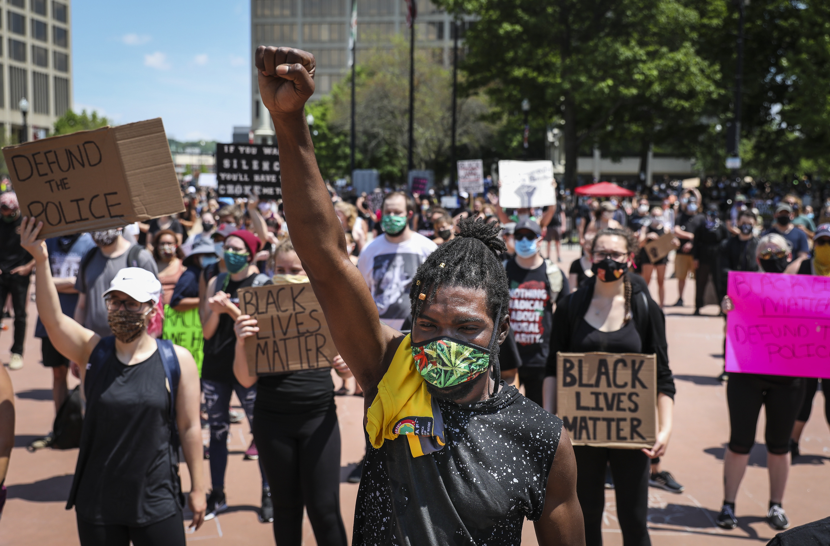 Typhain Hatchoua held up his fist in solidarity as he joined hundreds of demonstrators who gathered for a "Justice for George Floyd" rally in front of Worcester's city hall.