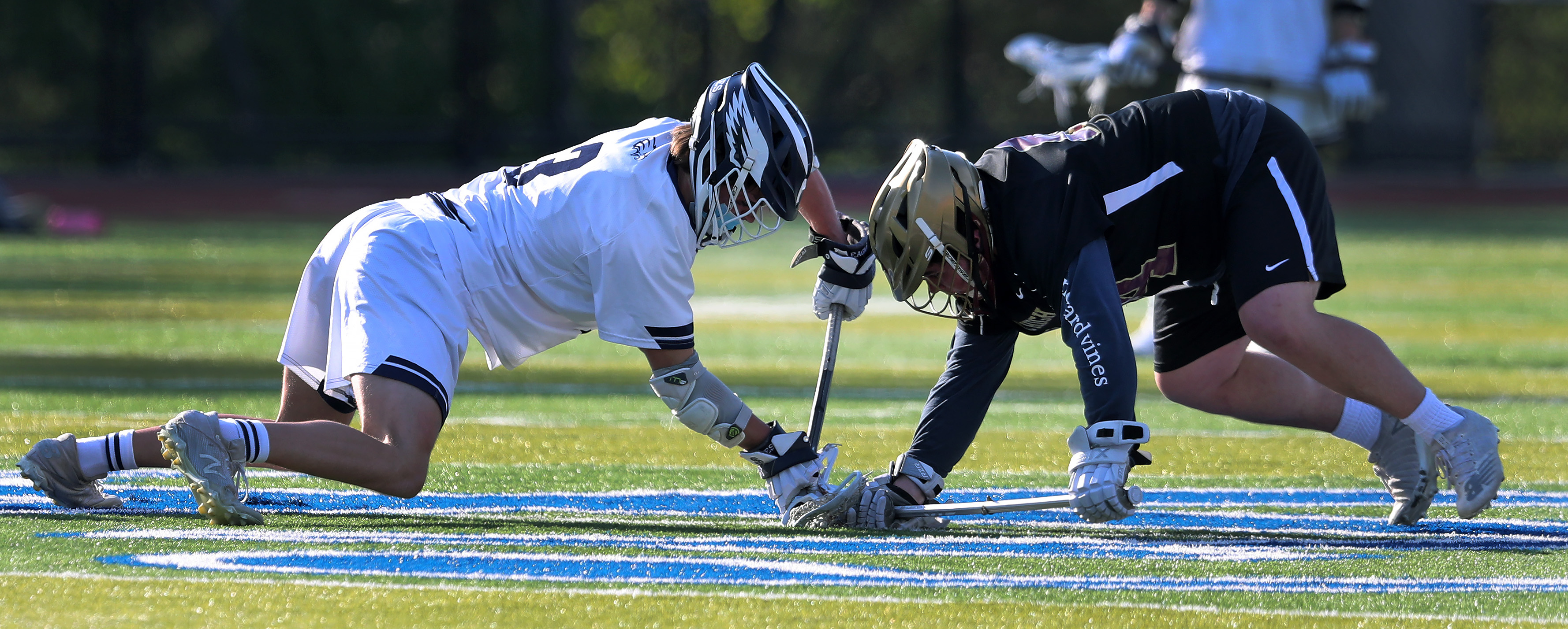 Graham Tyson (left) of St. John's Prep faces off against BC High's Joe LaRosa during Catholic Conference action Monday.