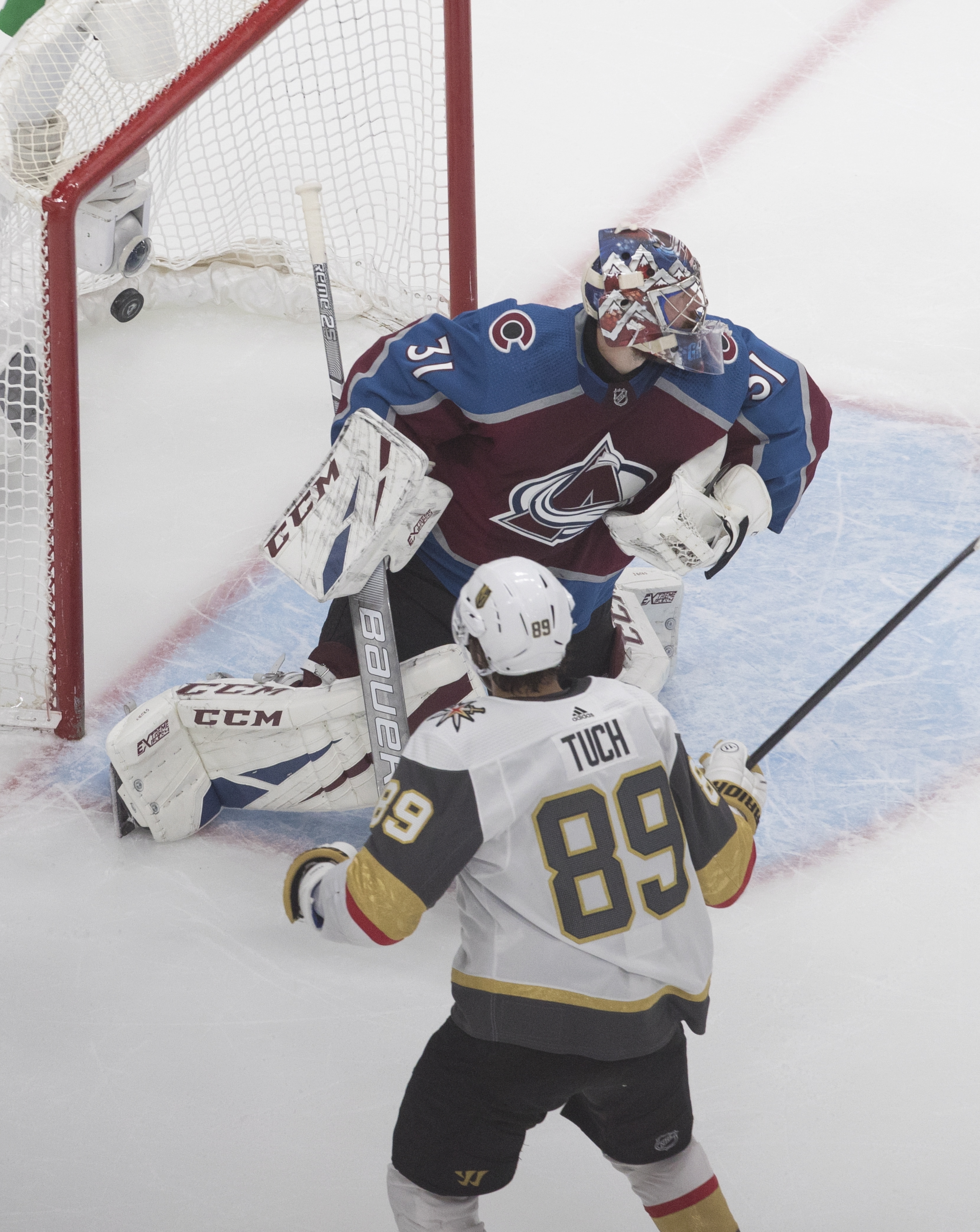 Vegas' Alex Tuch watches his overtime goal slip past Colorado goalie Philipp Grubauer.