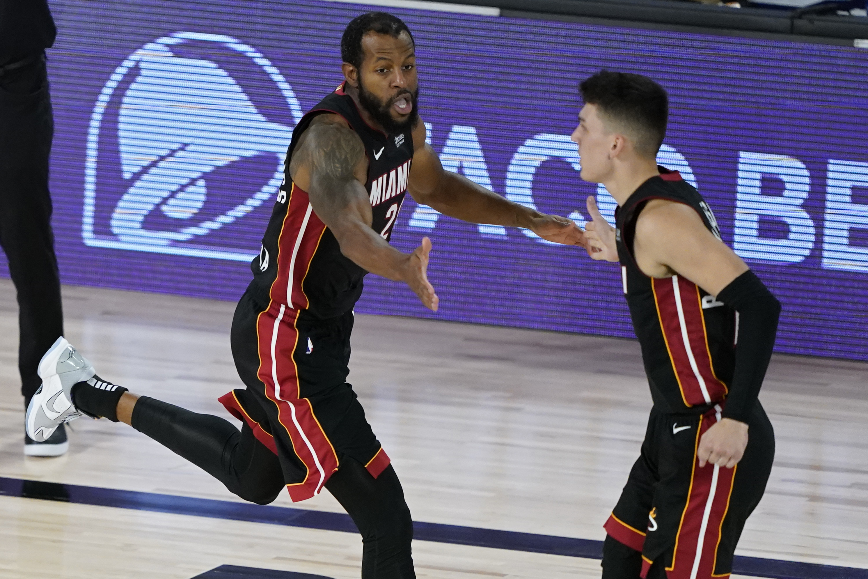 Andre Iguodala, left, is averaging 18.9 minutes per game off the bench for the Heat in the postseason.