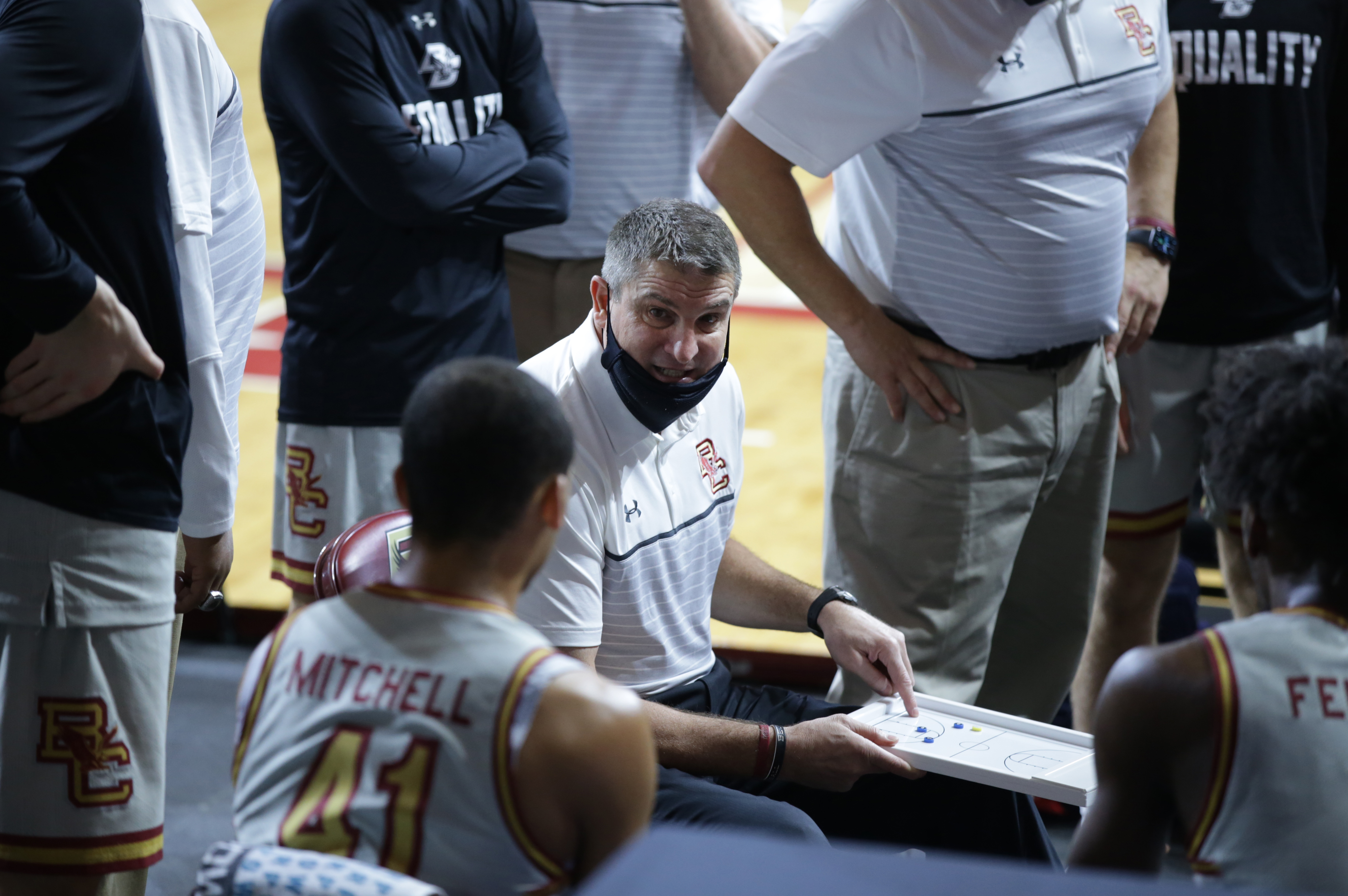 Jim Christian talks with his team during a timeout in a game last month.