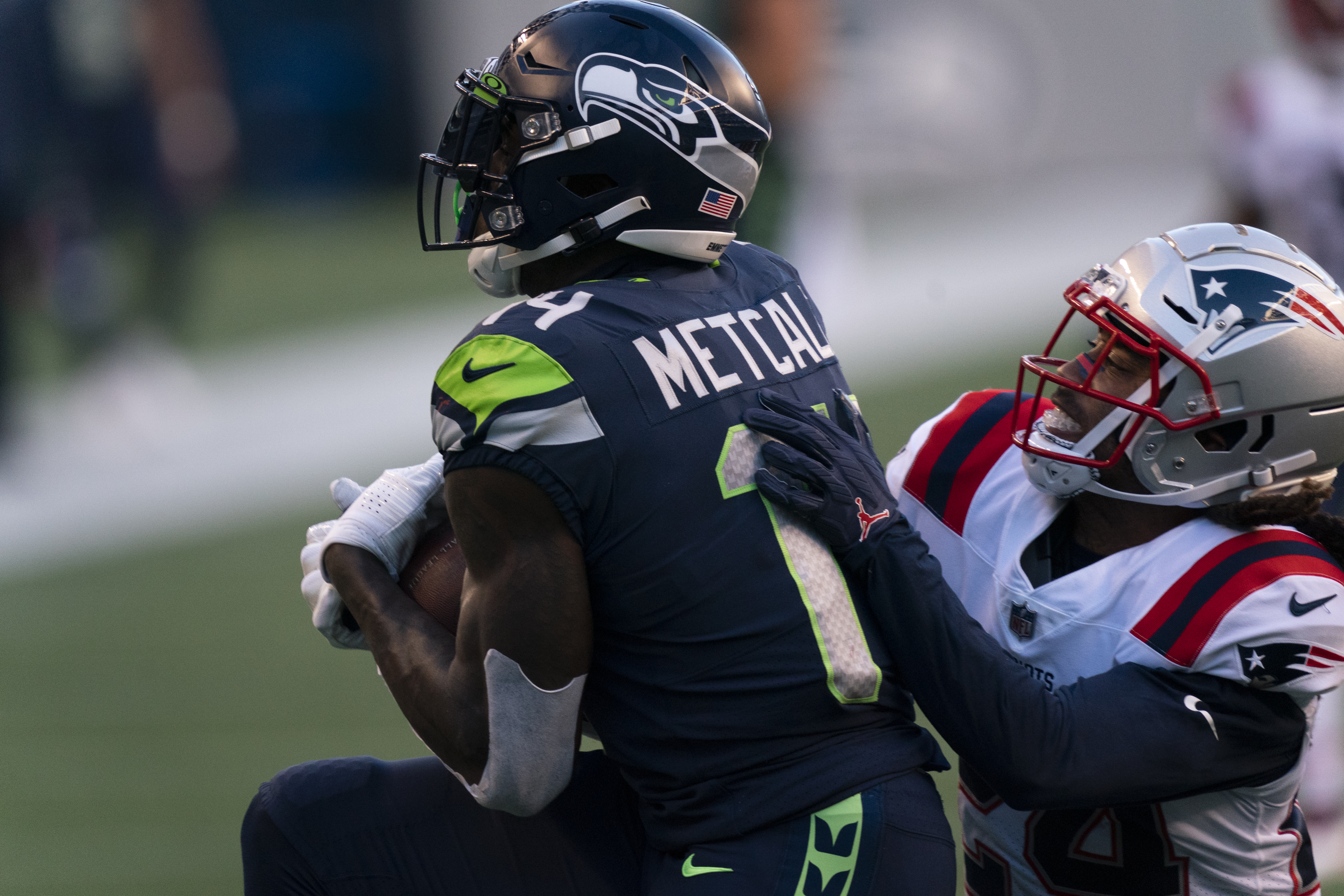 Stephon Gilmore can't stop DK Metcalf from bringing in a touchdown catch on Sunday.