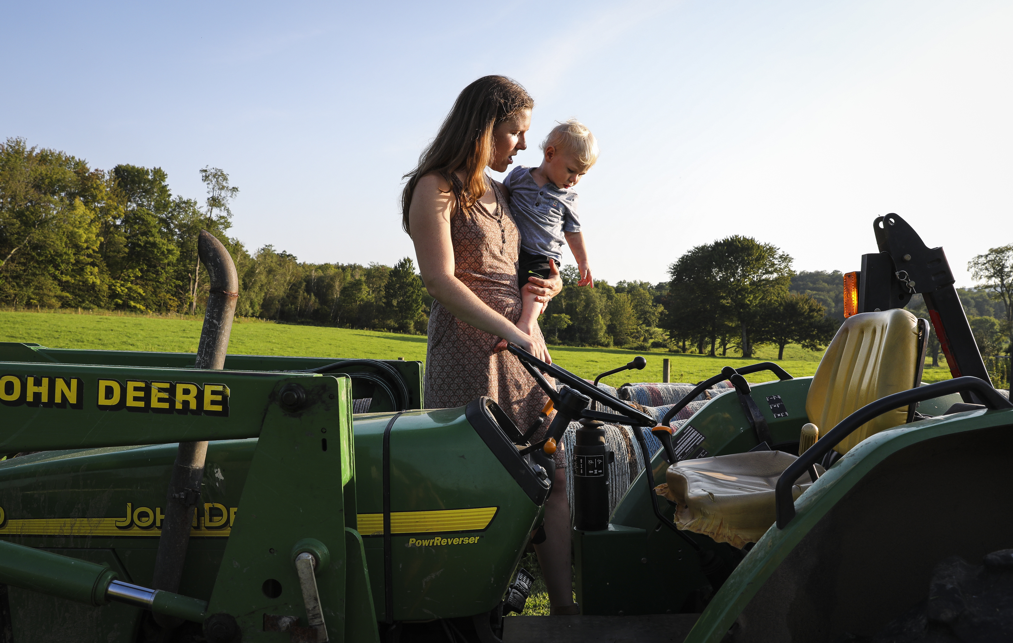 Sarah Lipinski holds her son, Cooley, who is 1. The family owns Sweet Brook Farm.