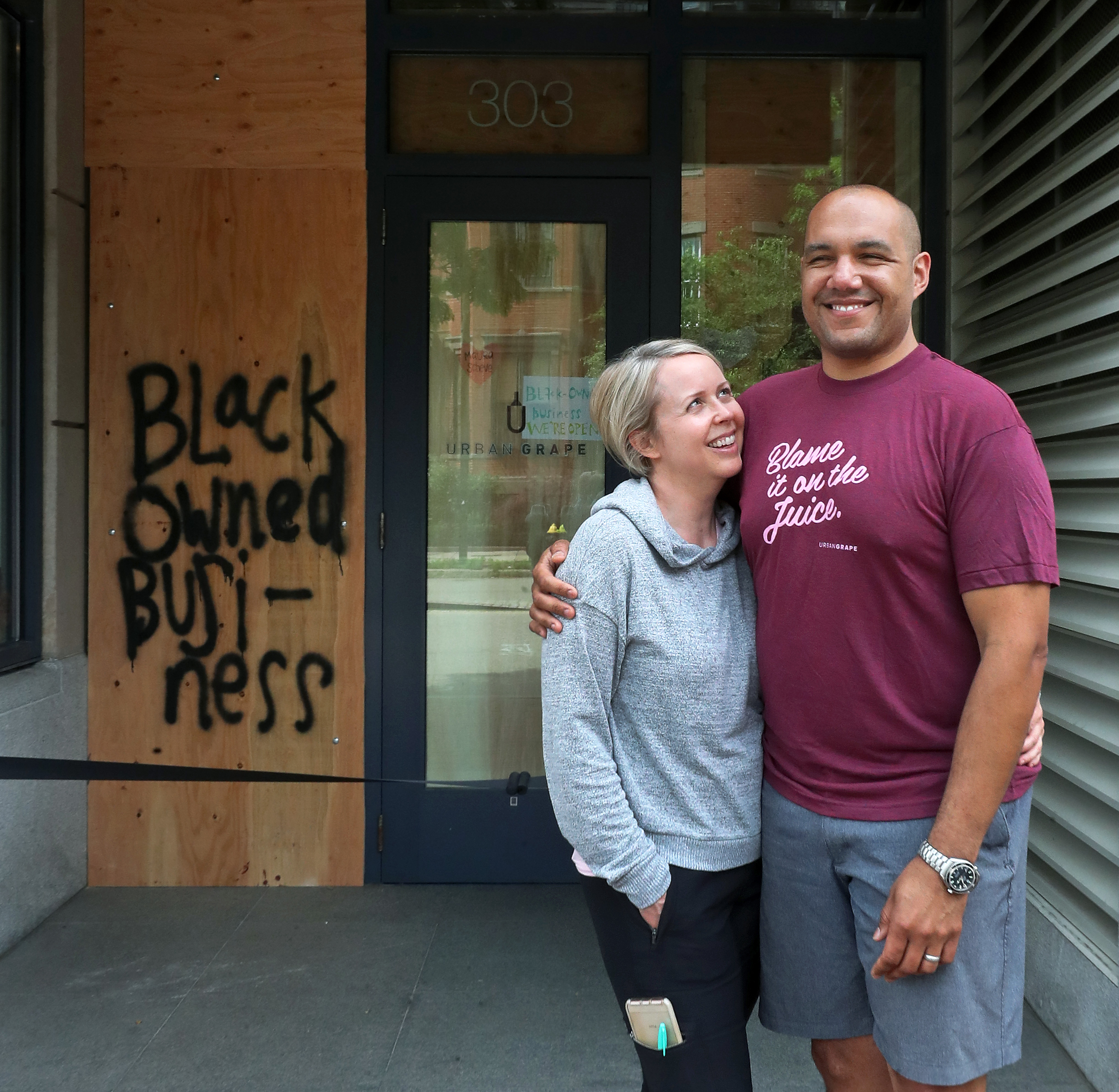 Hadley (left) and TJ Douglas, the owners of the Urban Grape wine store on Columbus Avenue in the South End.