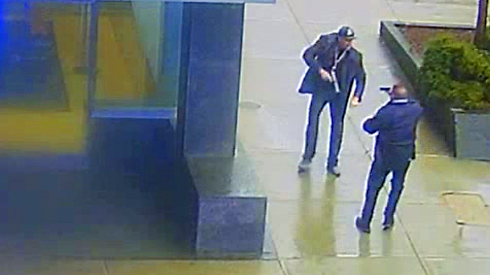 Norfolk DA released photos of a confrontation between a Boston police officer and Juston Root, brandishing a fake gun, on Feb. 7 outside Brigham and Women's Hospital.
