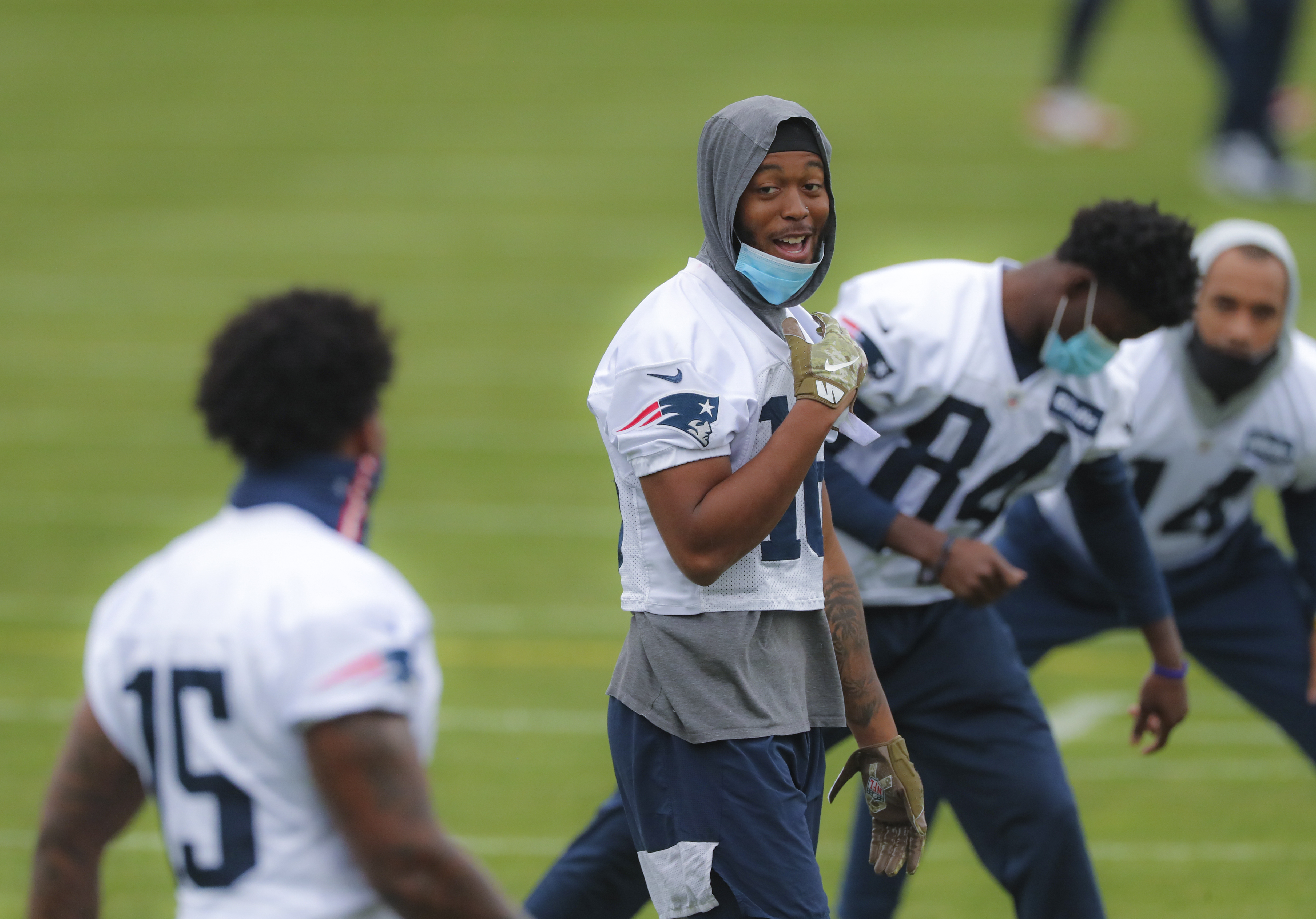 Jakobi Meyers chats with teammate N’Keal Harry during Wednesday's practice.