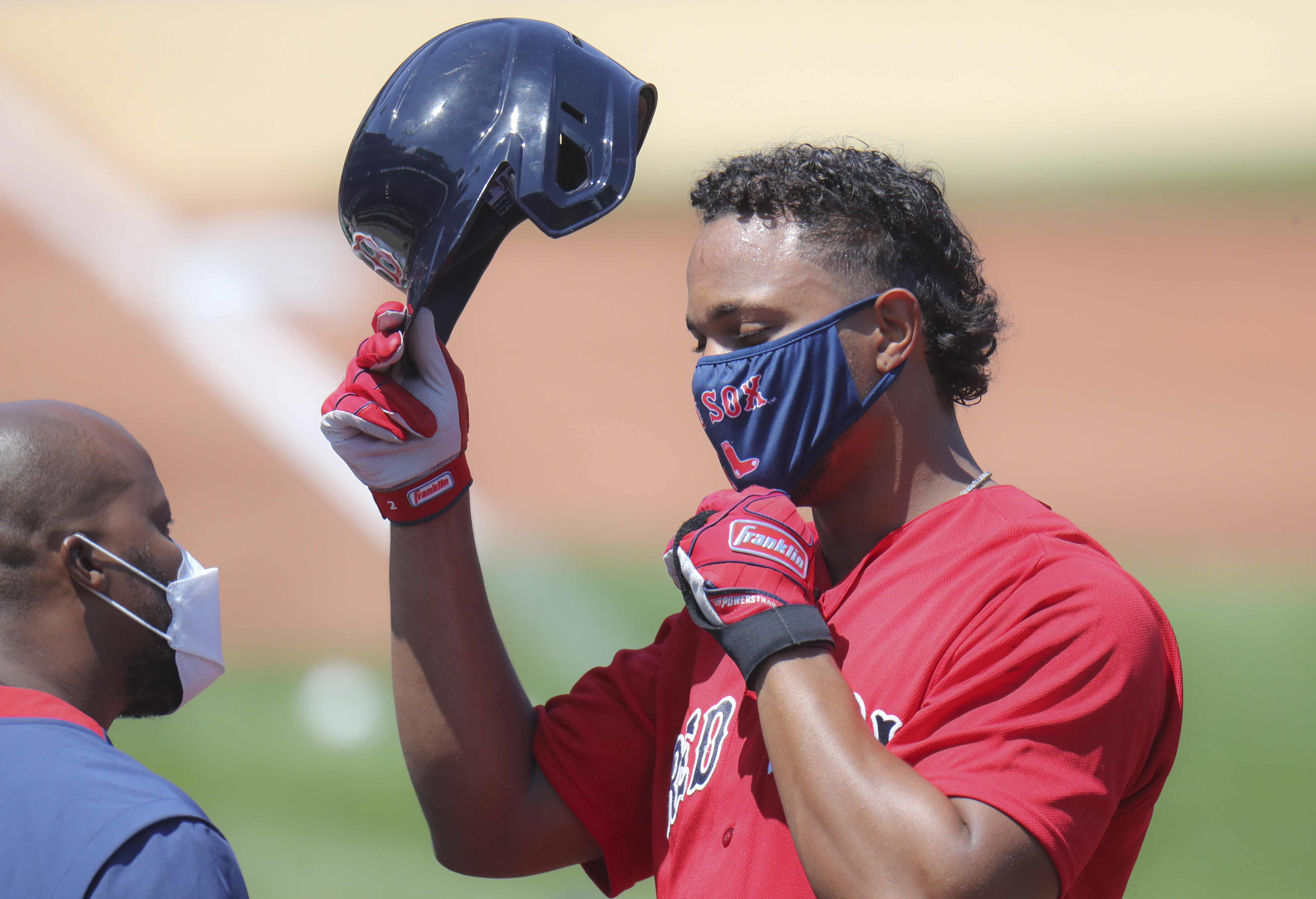 Xander Bogaerts adjusted his mask during a Red Sox intrasquad game at Fenway Park.